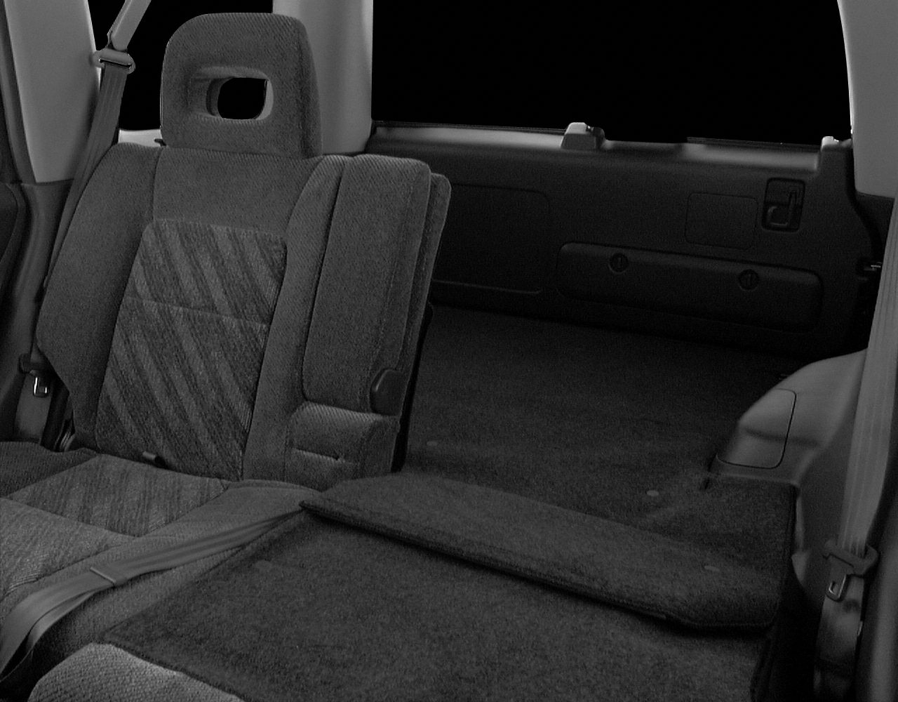 Rear seating and cargo space with foldable seats