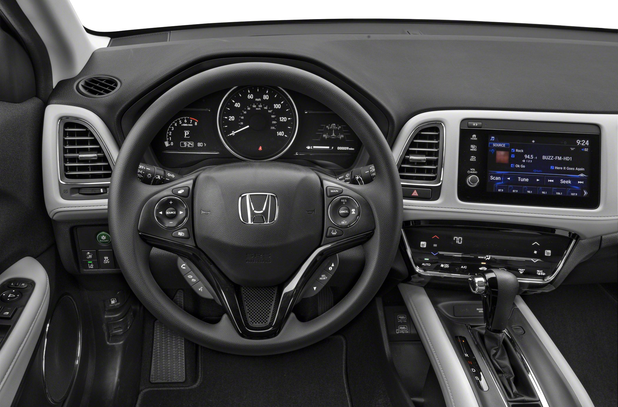 Steering wheel, digital instrument cluster, infotainment system, and center console controls