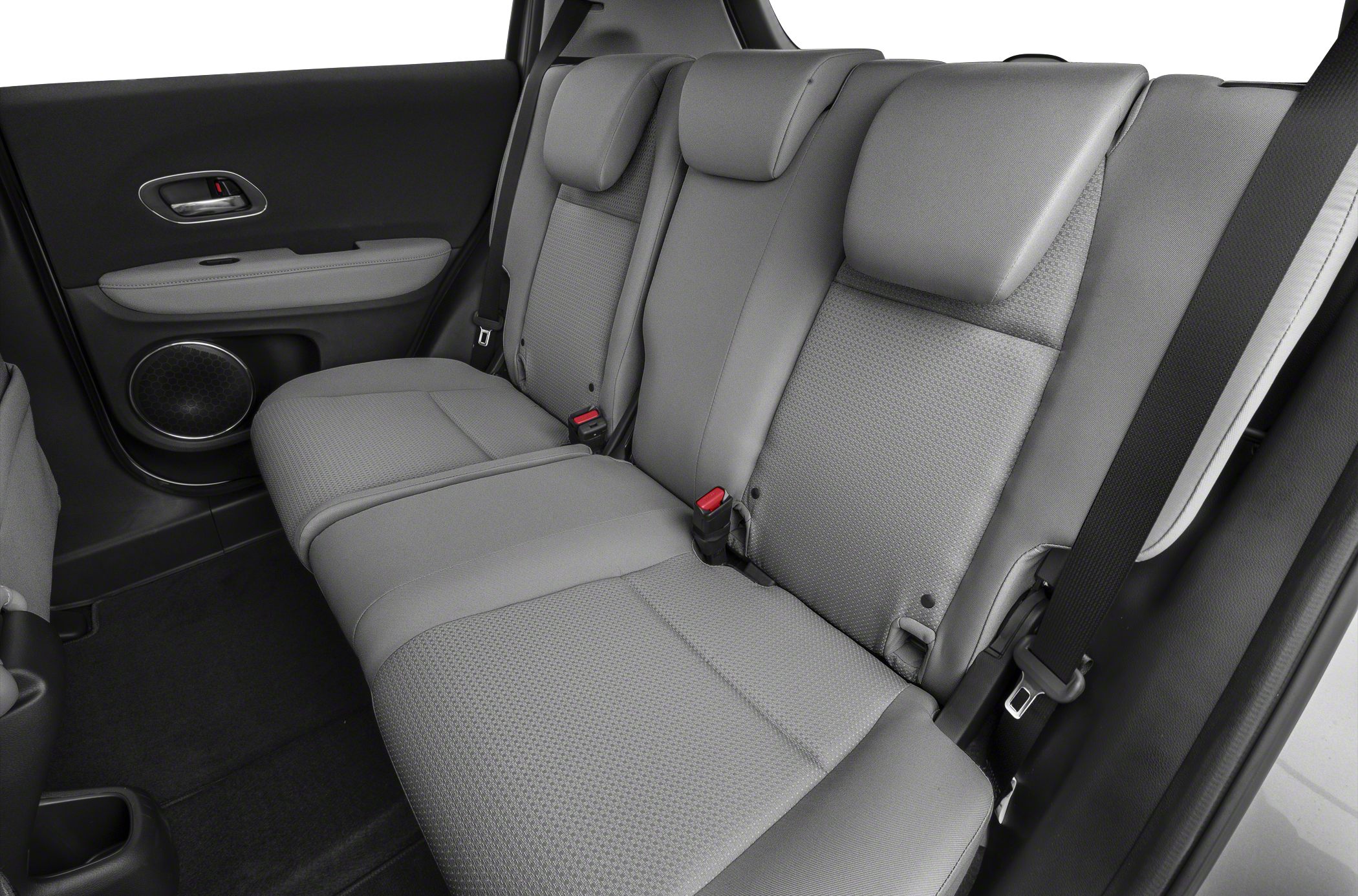 Rear passenger seats with headrests, seat belt, and door speaker