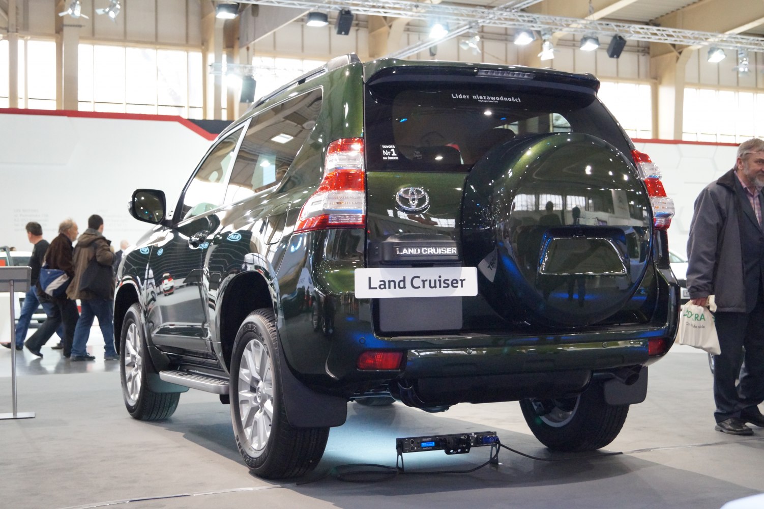 Rear view with mounted spare tire and distinct tail lights