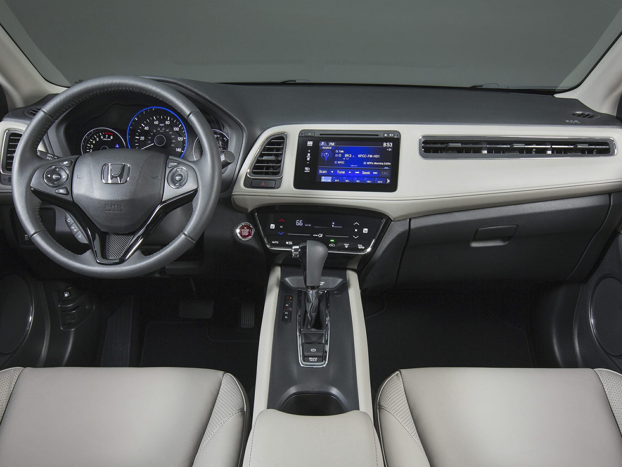 Dashboard and steering wheel with multifunction controls and infotainment display