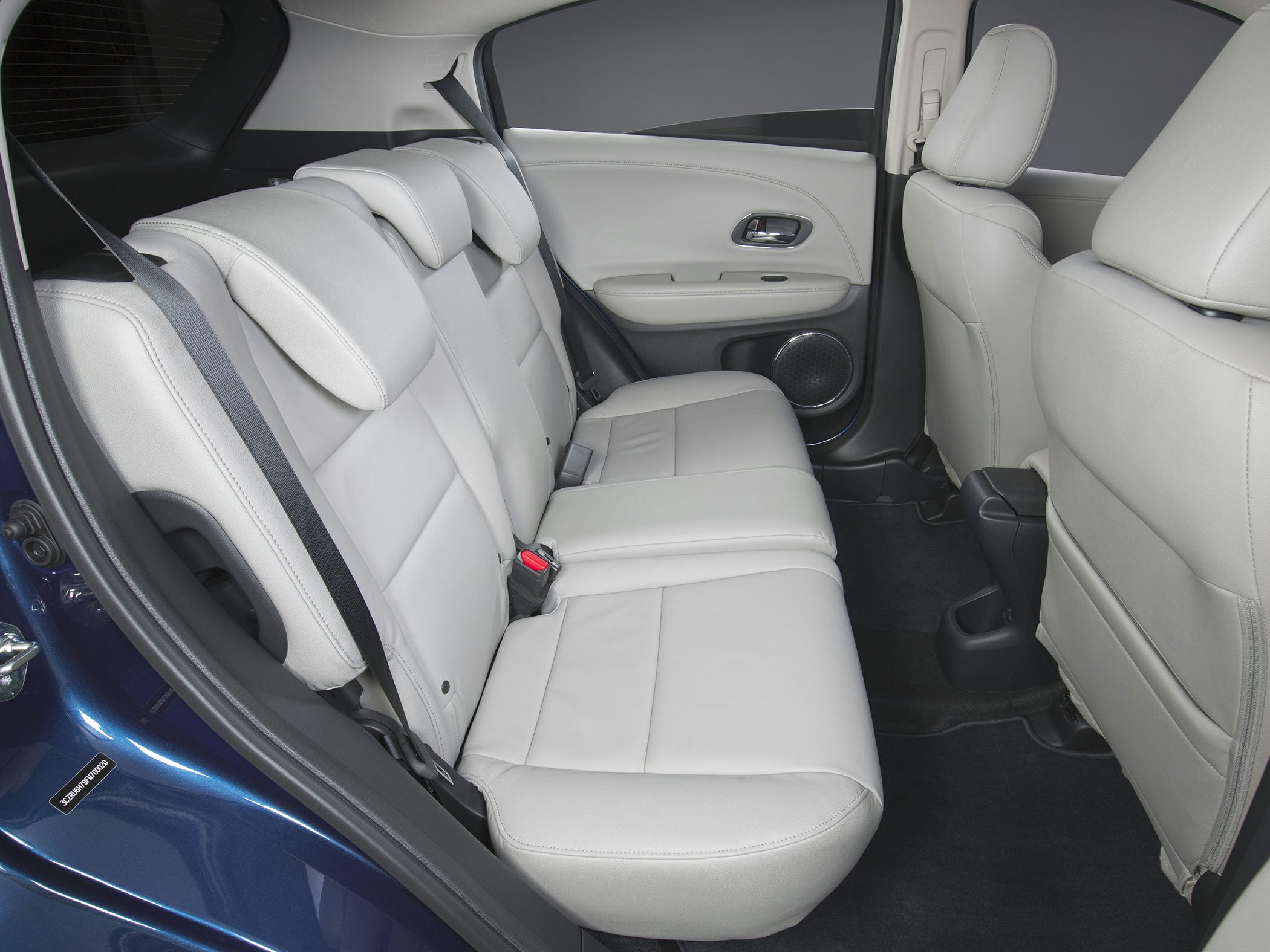 Rear seat with light leather upholstery and integrated headrests