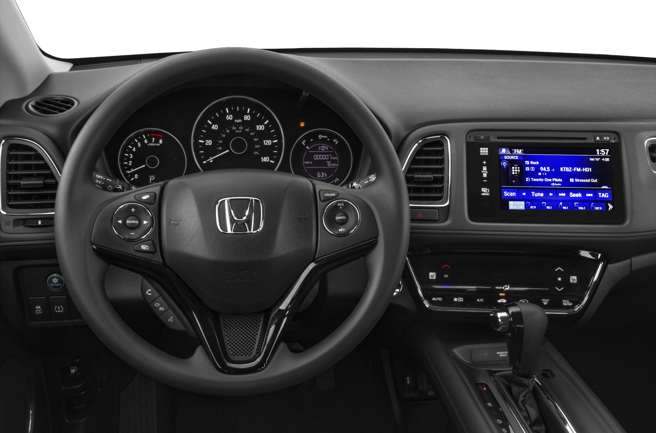 Steering wheel with control buttons and digital dashboard display.