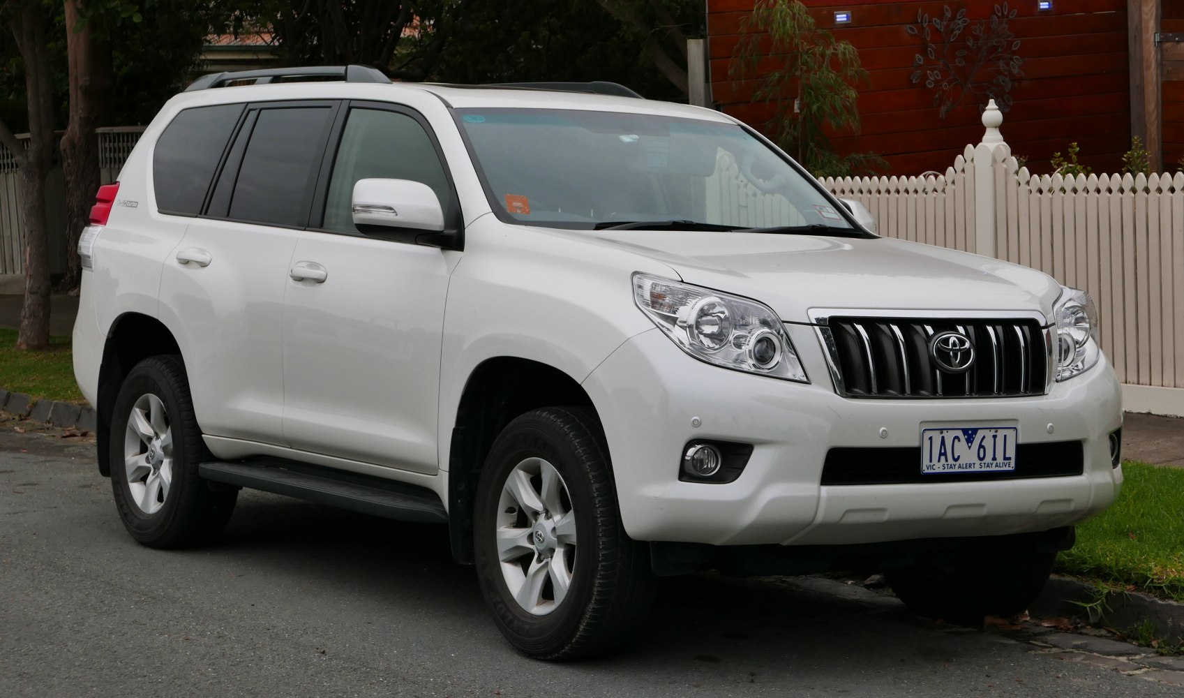 White SUV front side showing grille and headlights