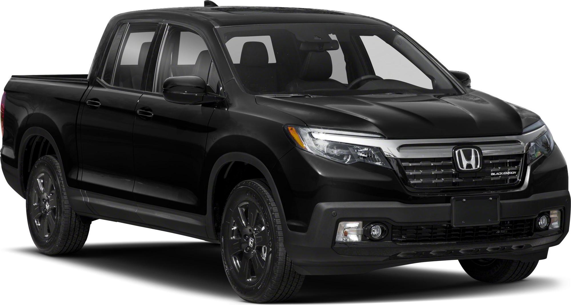 Black pickup truck front-side with distinct grille and headlight