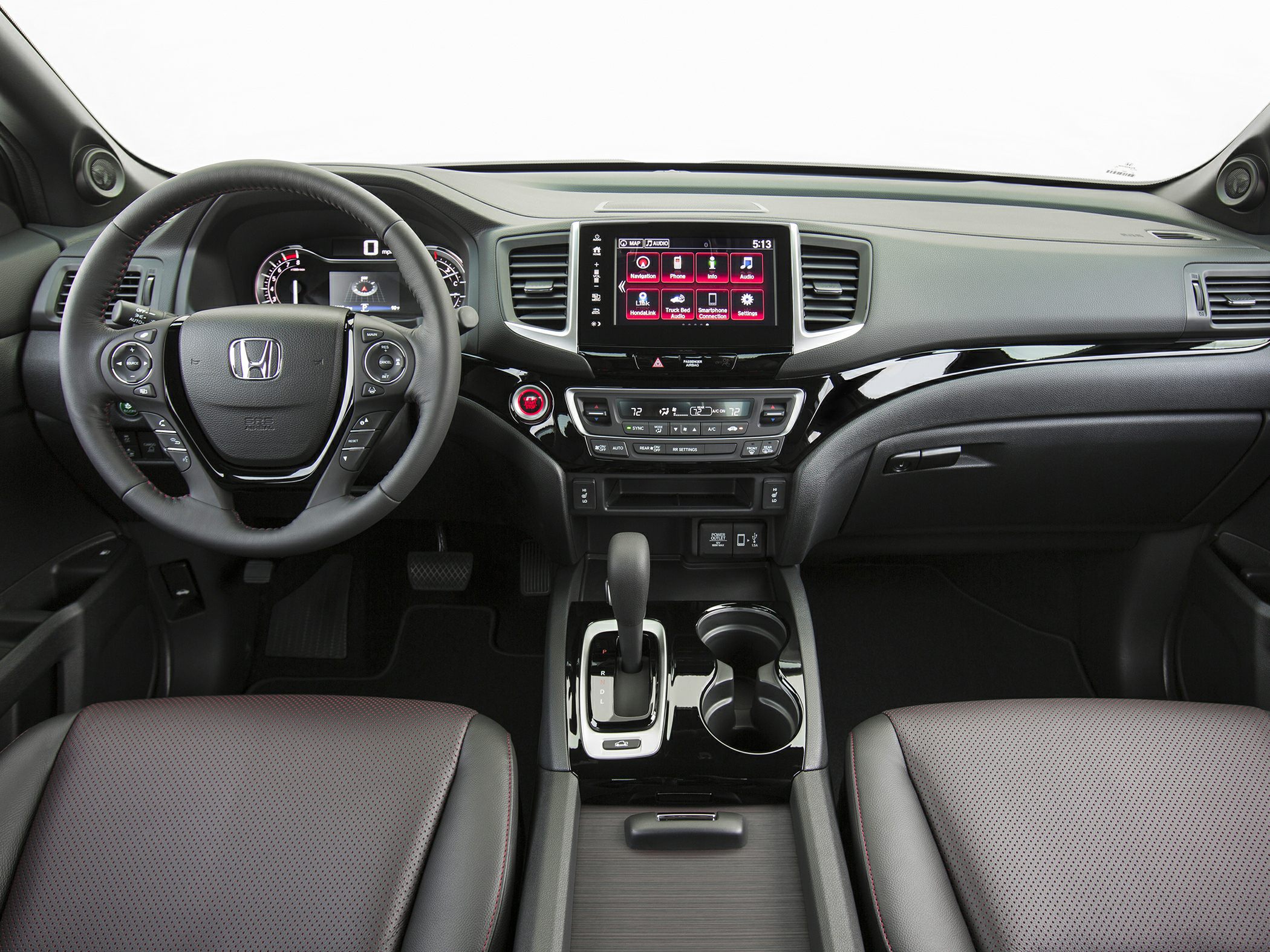 Modern vehicle dashboard with touchscreen and multifunction steering wheel