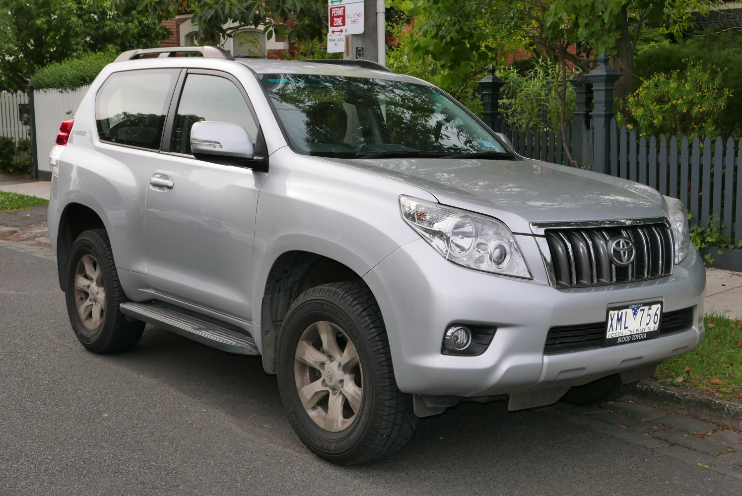 Silver 3-door SUV with prominent front grille and headlights