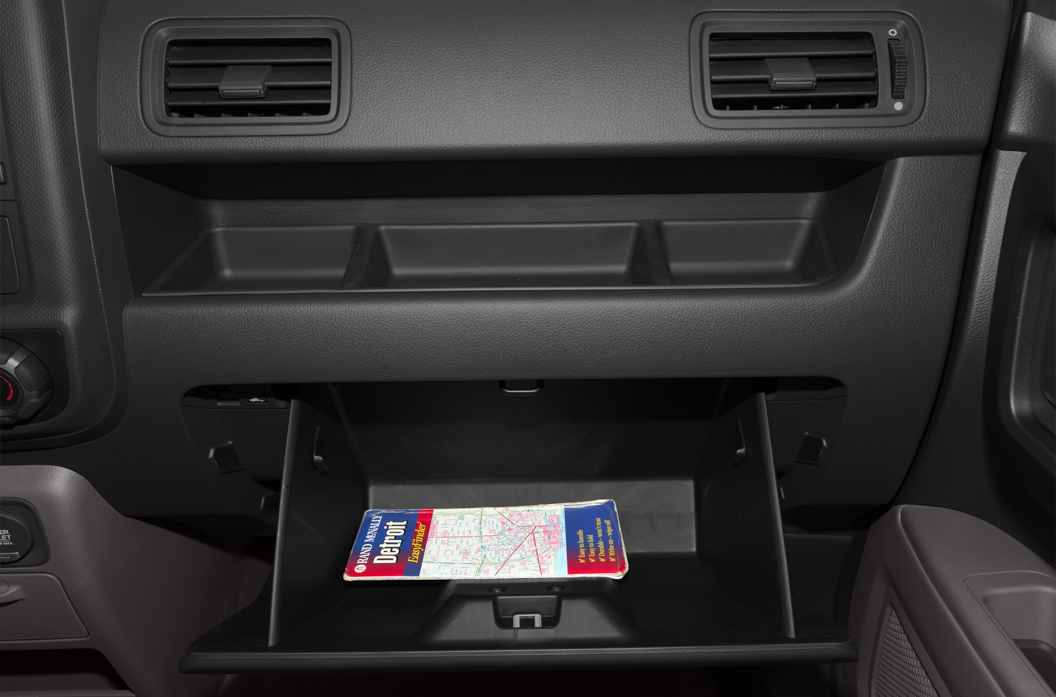 Glove box storage with dashboard air vents above