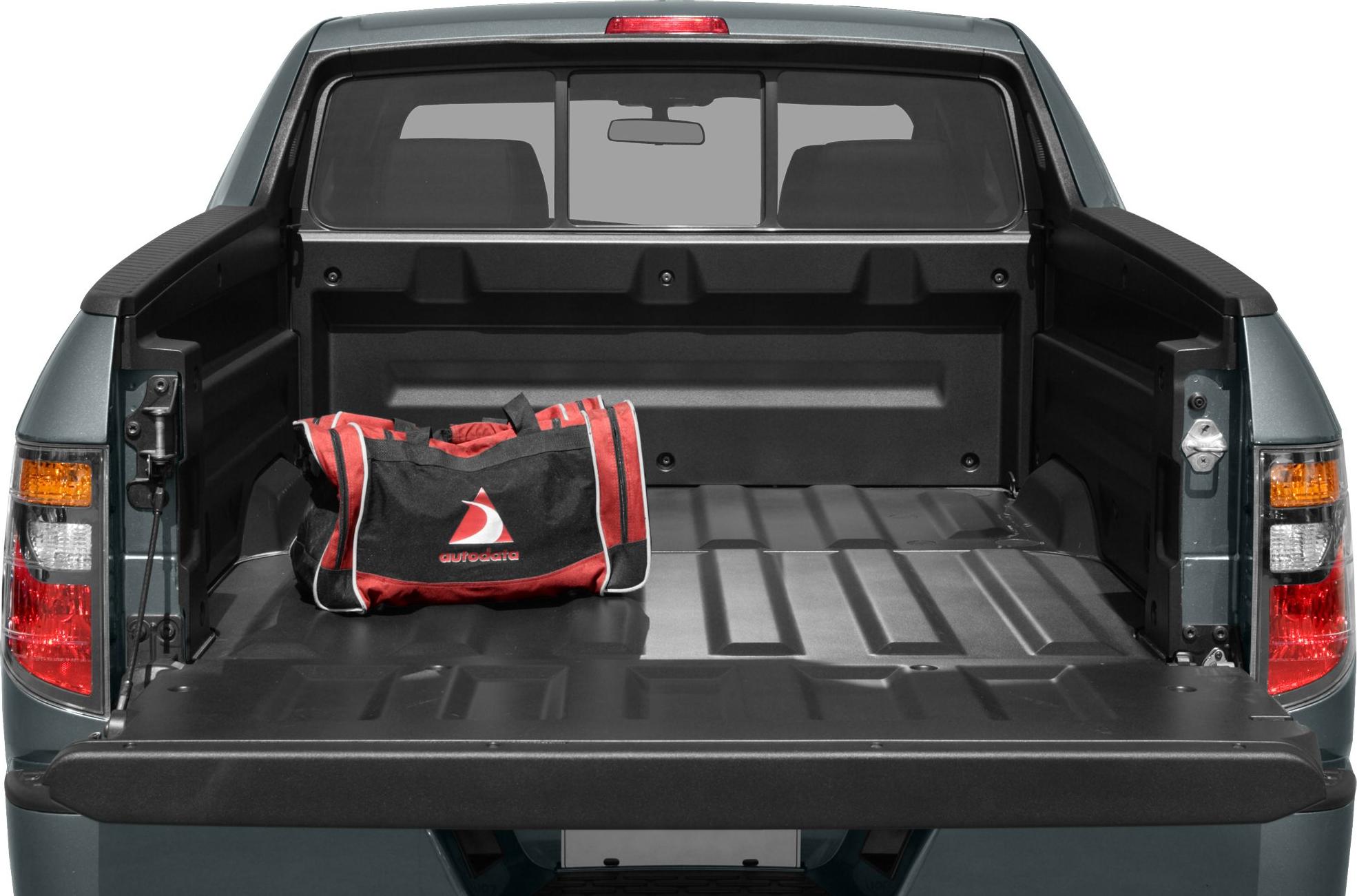 Open pickup truck bed with tailgate and a duffle bag