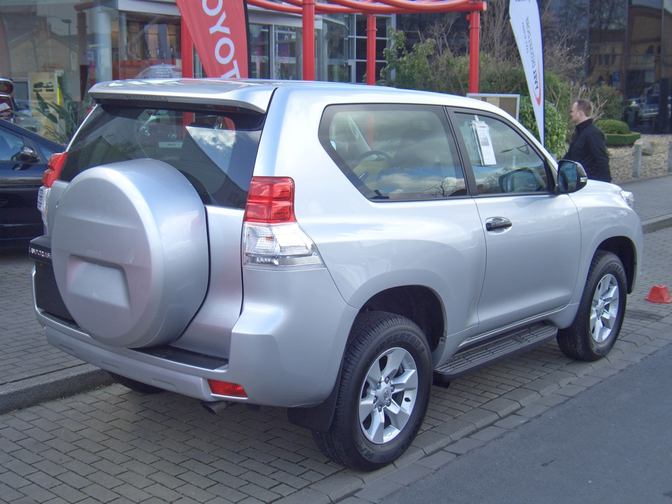 SUV with rear-mounted spare tire and 3-door body design