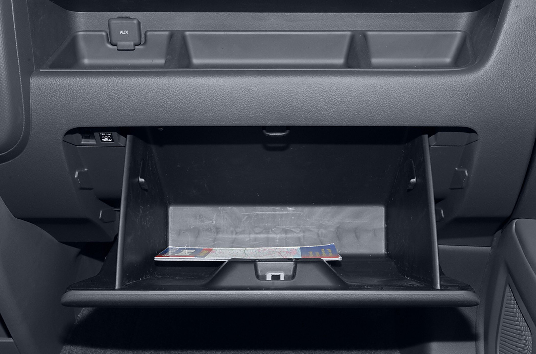 Open glove compartment with auxiliary input and storage compartments