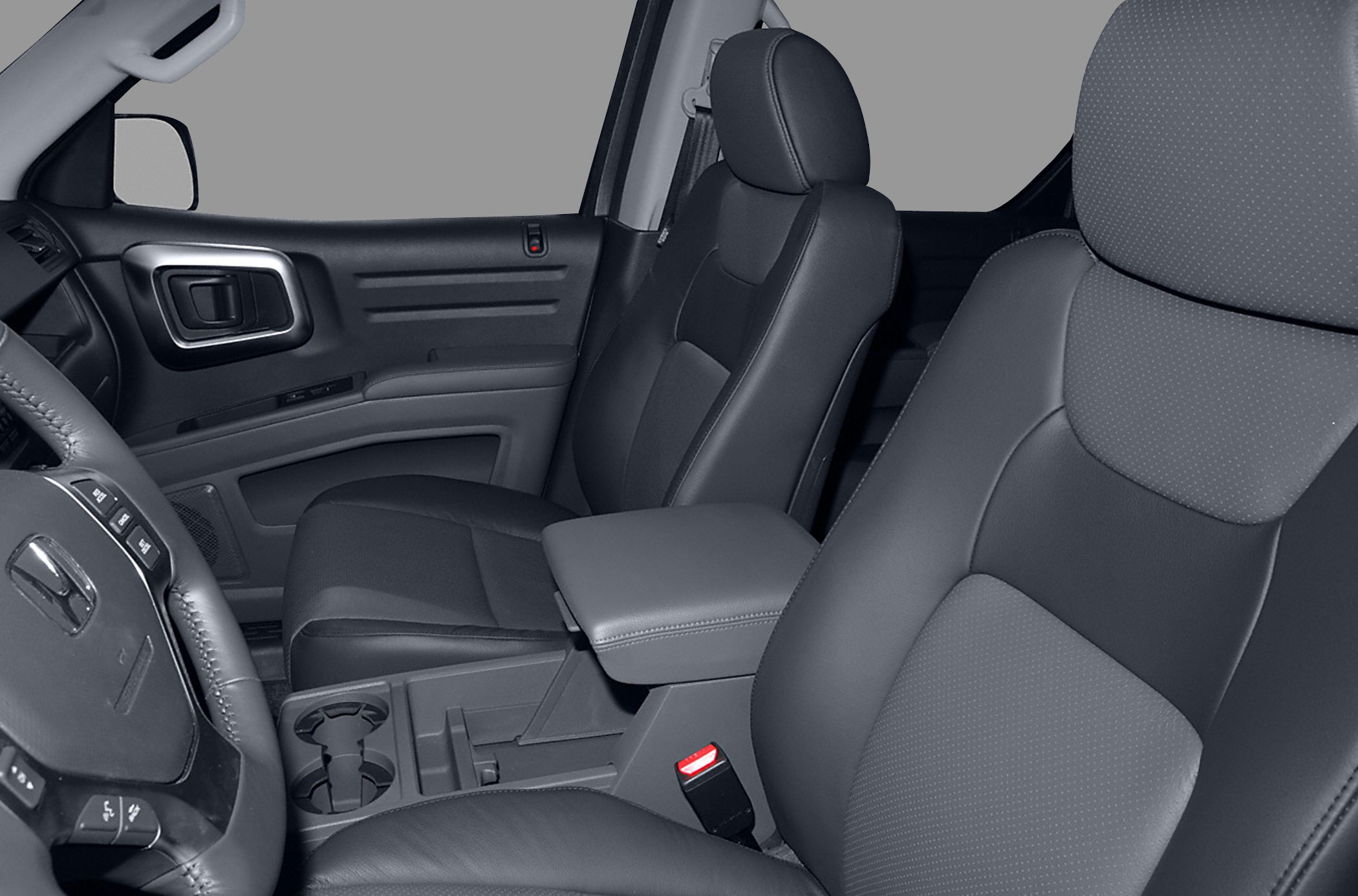 Close-up of front leather seats and center armrest in vehicle interior