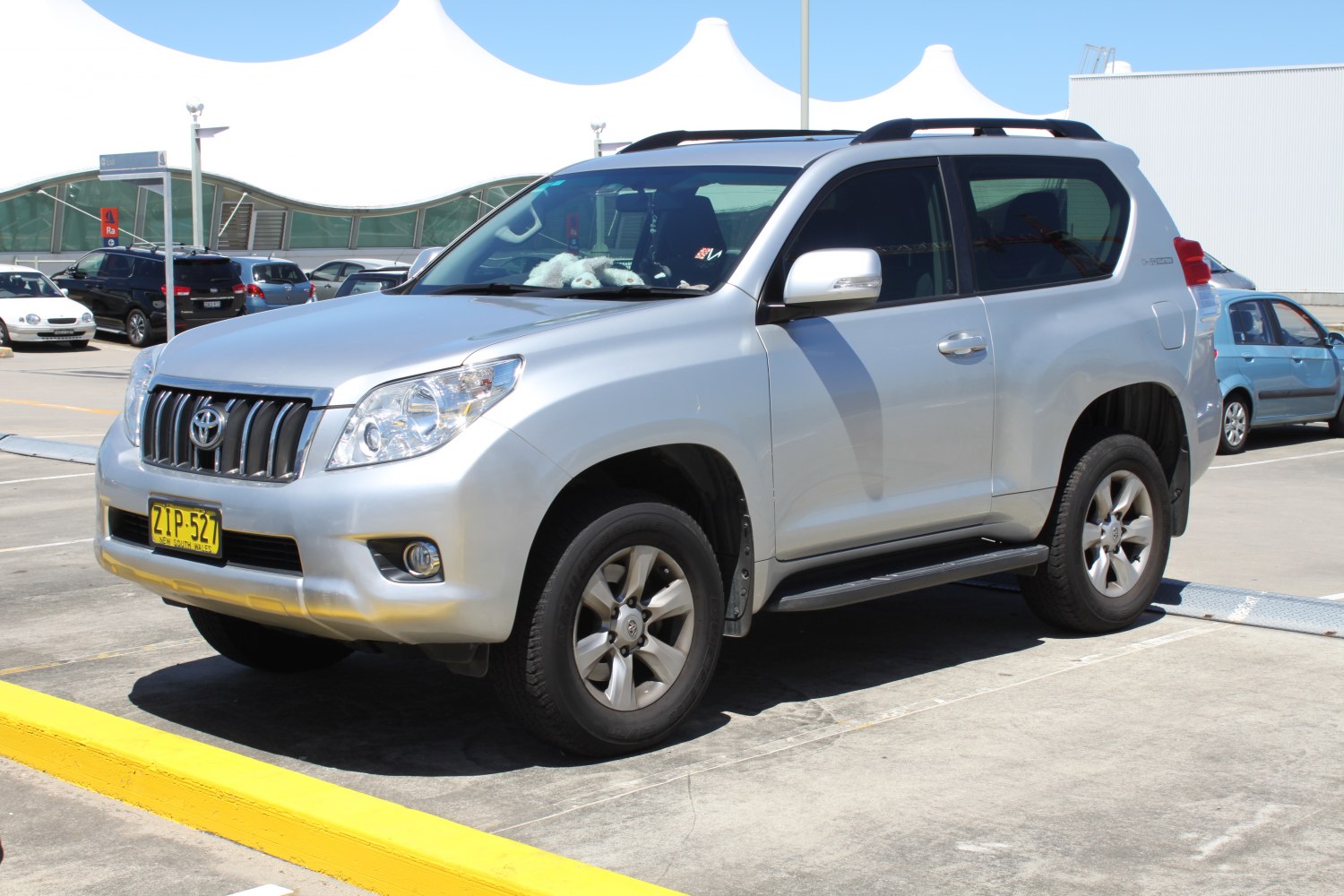 Silver 3-door SUV front-side view with alloy wheels and roof rails