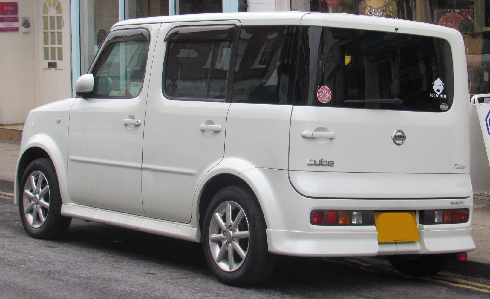 Compact boxy hatchback rear side view with alloy wheels