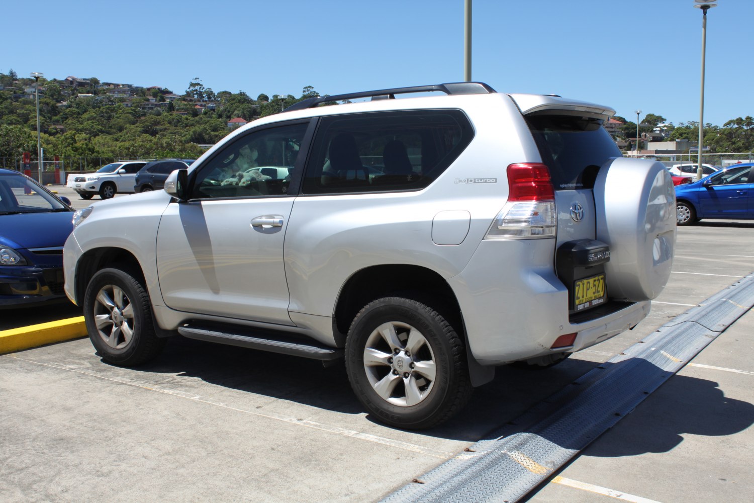 3-door SUV with prominent spare tire mount and alloy wheels