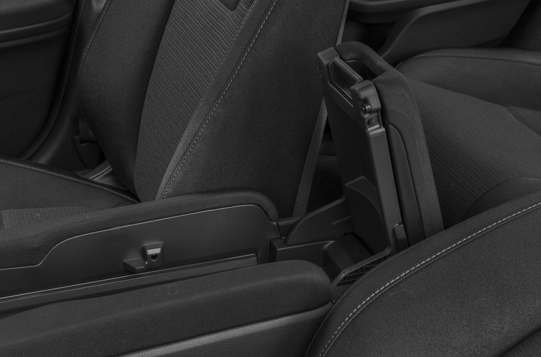 Front seat armrest with storage compartment in black upholstery