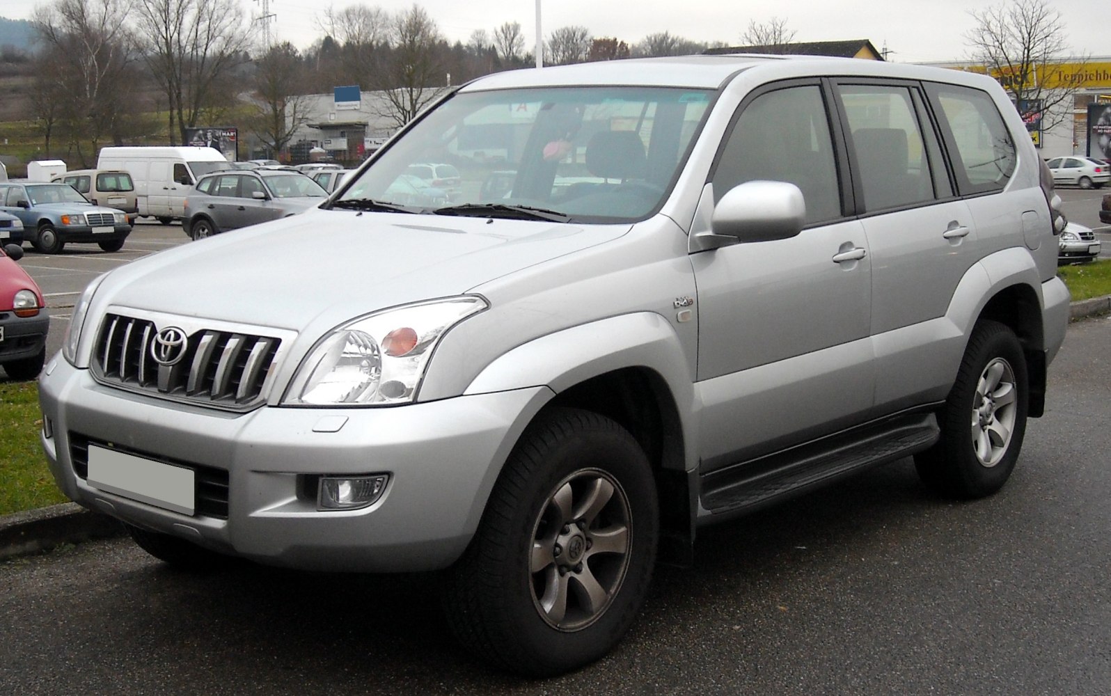 Silver SUV with bold grille and off-road tires