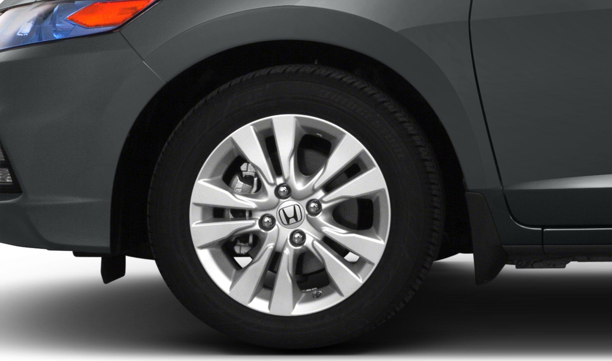 Alloy wheel multi-spoke design with visible brake caliper and tire tread
