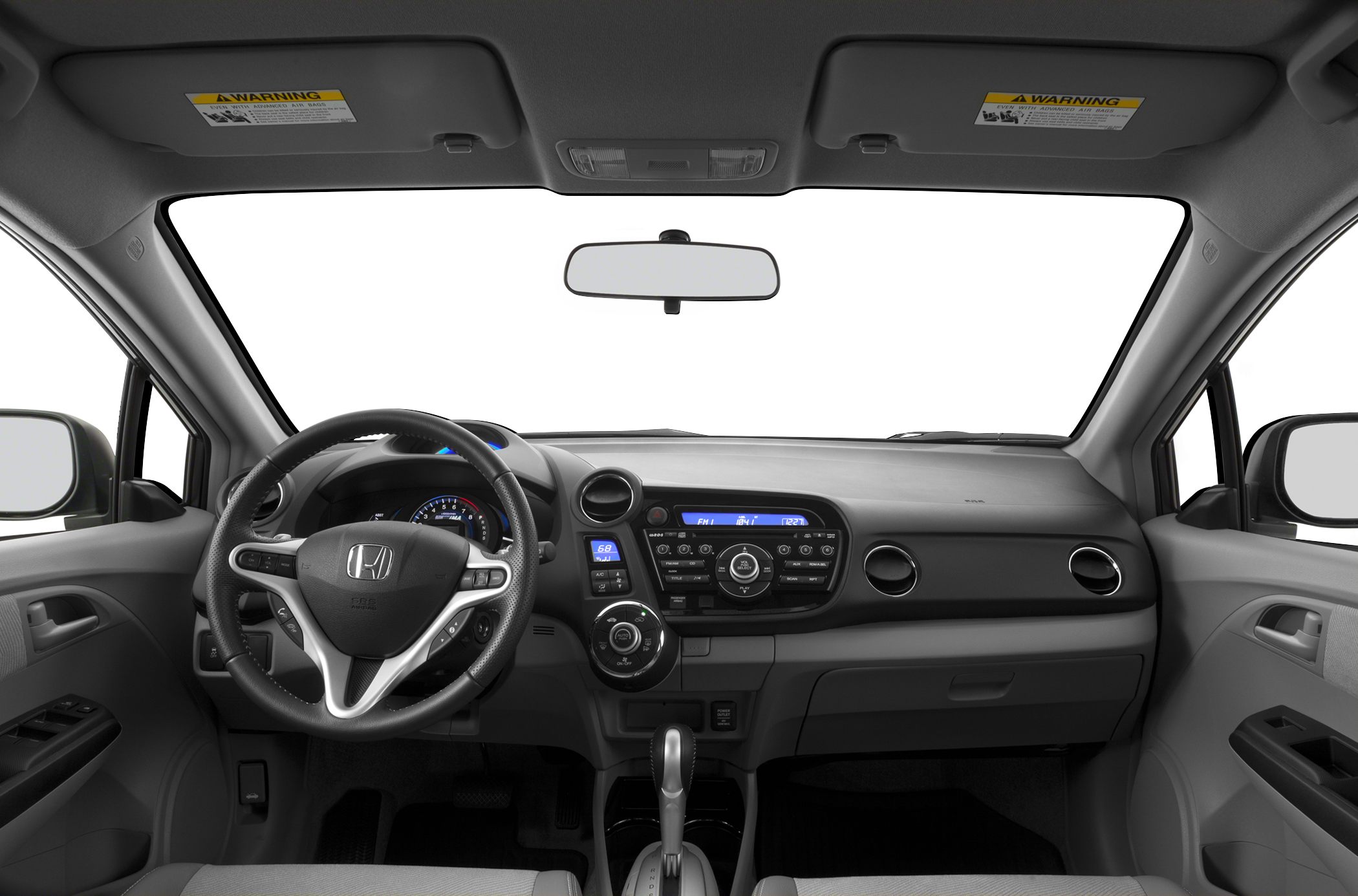 Interior dashboard with steering wheel, controls, and digital display