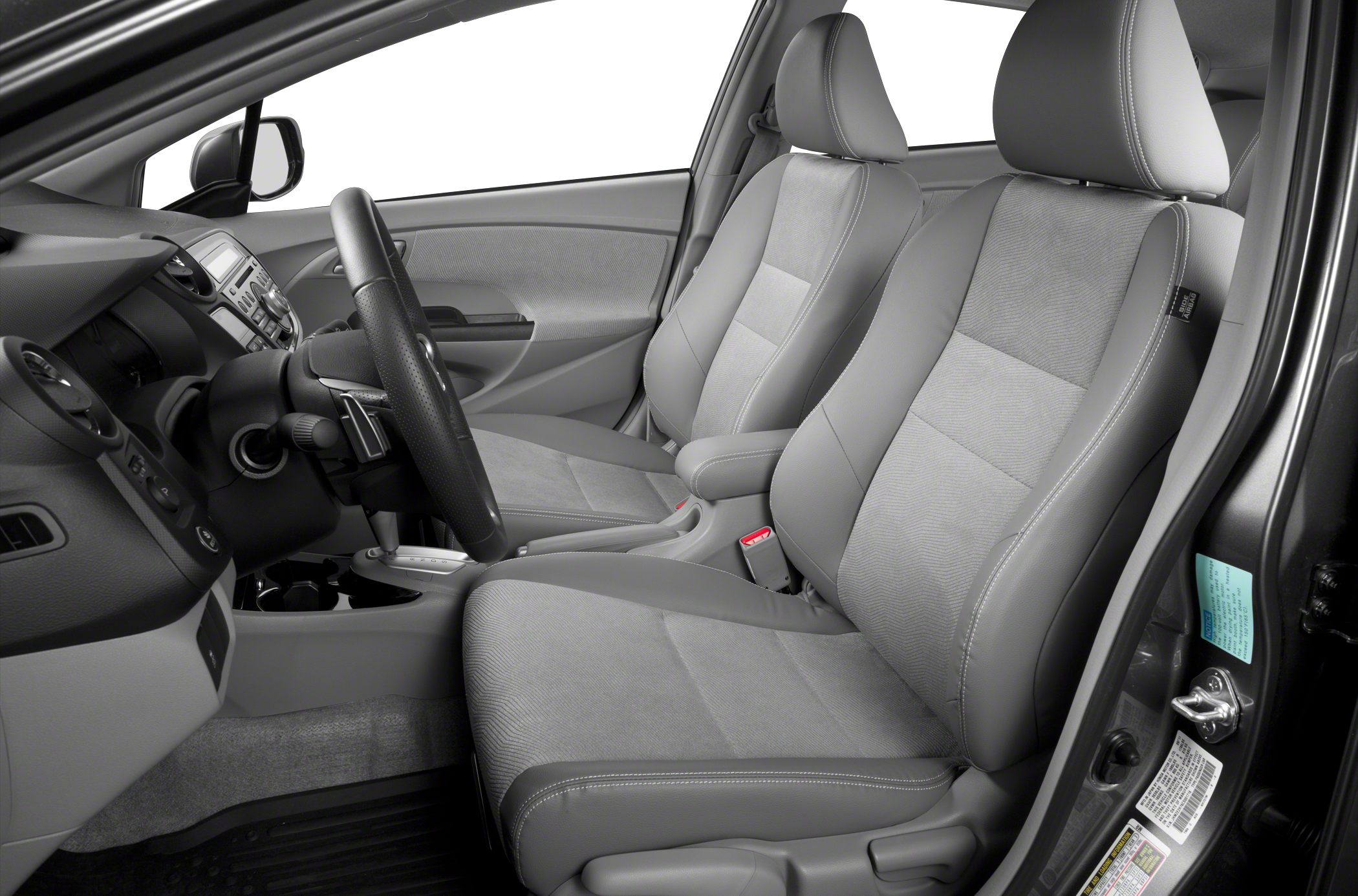 Gray front seats and dashboard with steering wheel
