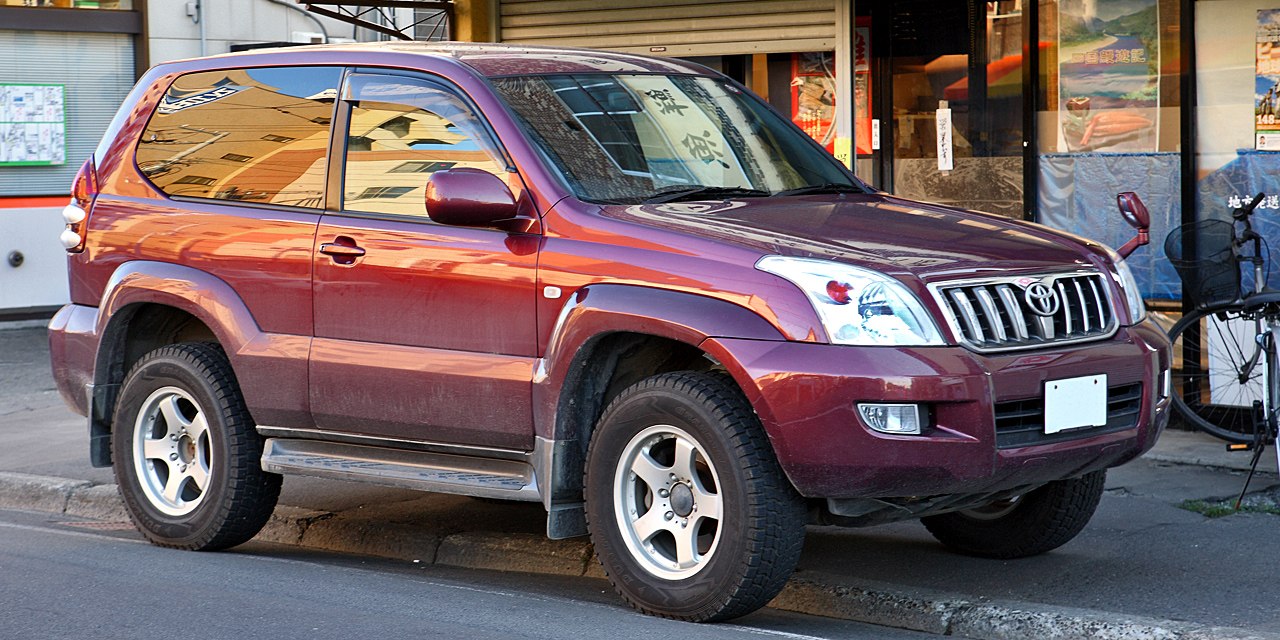 Front side view of rugged SUV with alloy wheels and tinted windows