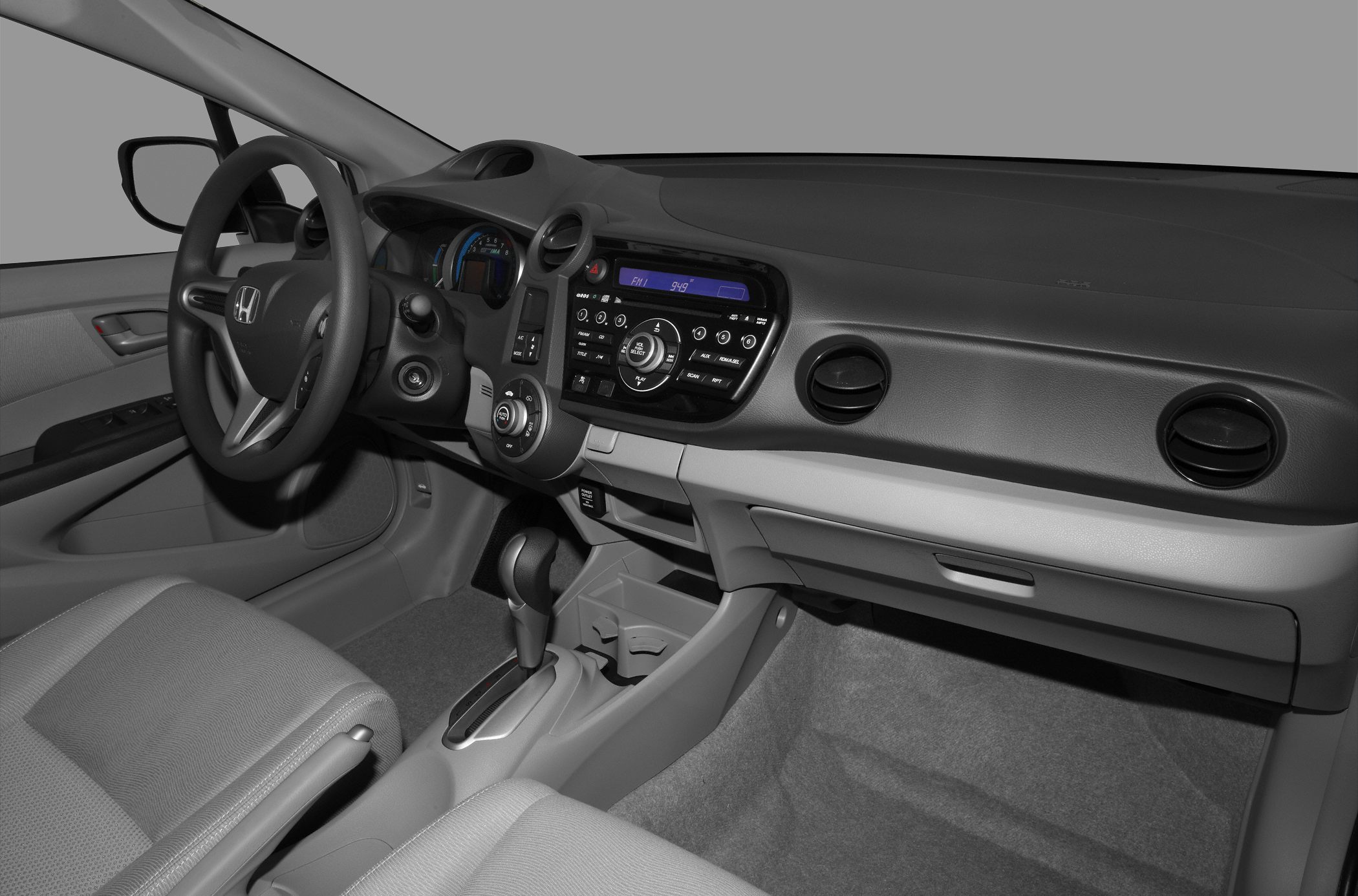 Digital dashboard and modern audio controls inside a vehicle