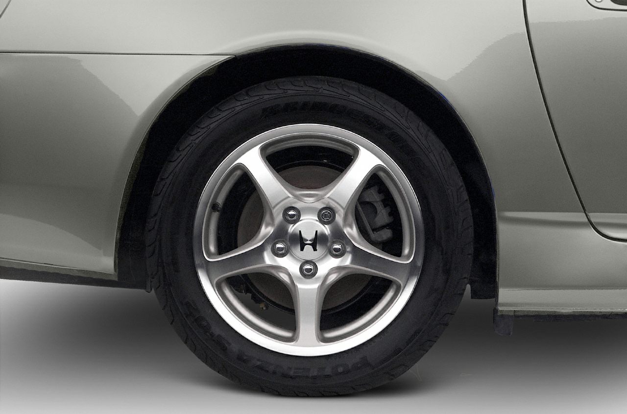 Alloy wheel with five spokes and visible brake caliper