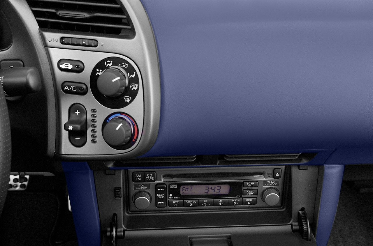 Car interior climate controls and stereo system with analog dials and buttons