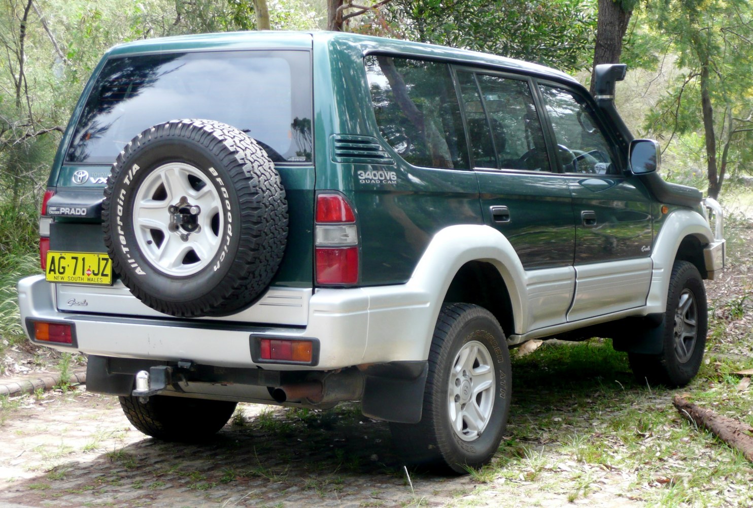 Rear side profile with spare tire and off-road features