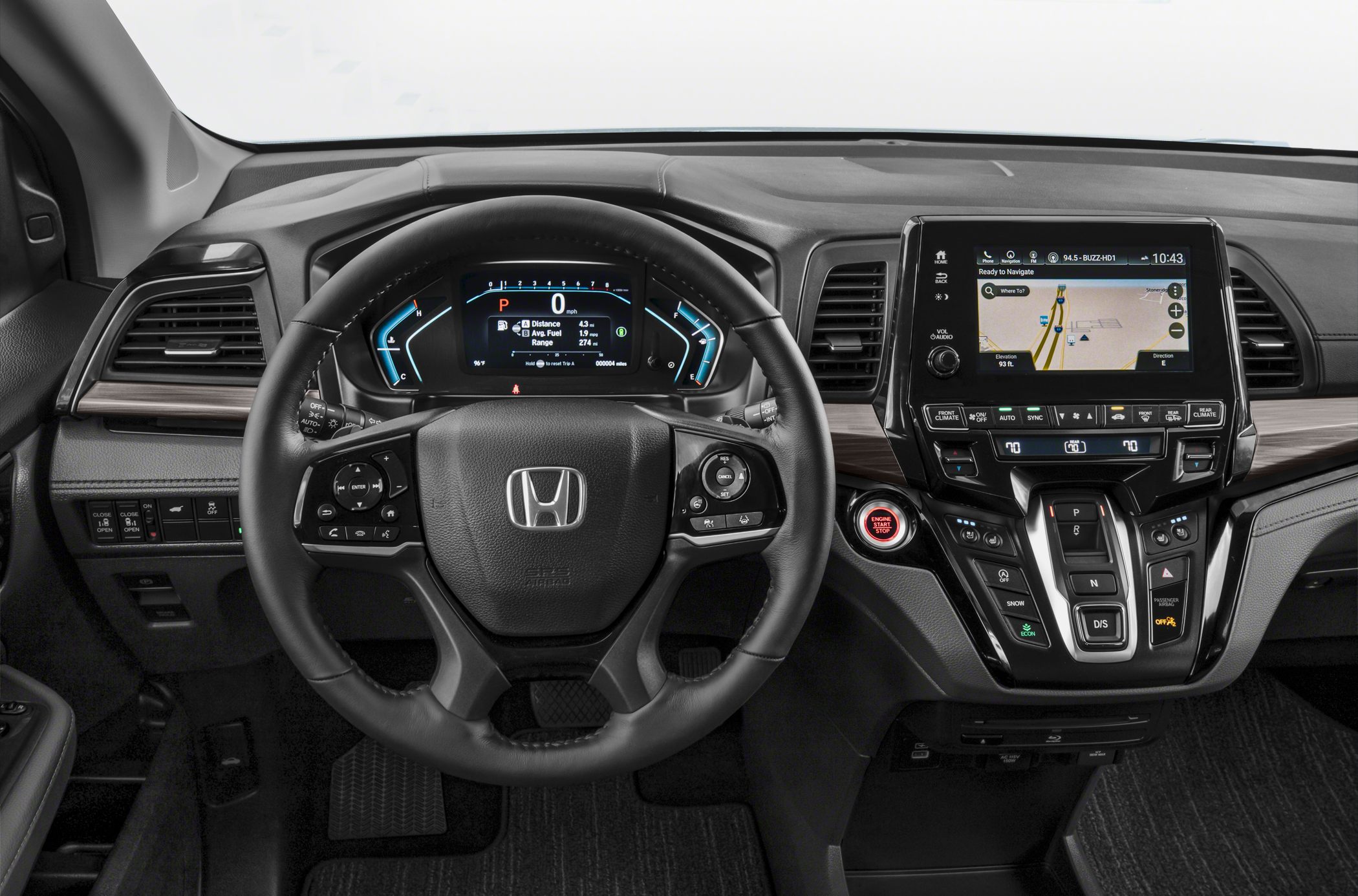 Steering wheel, digital dashboard, infotainment screen, and gear selector