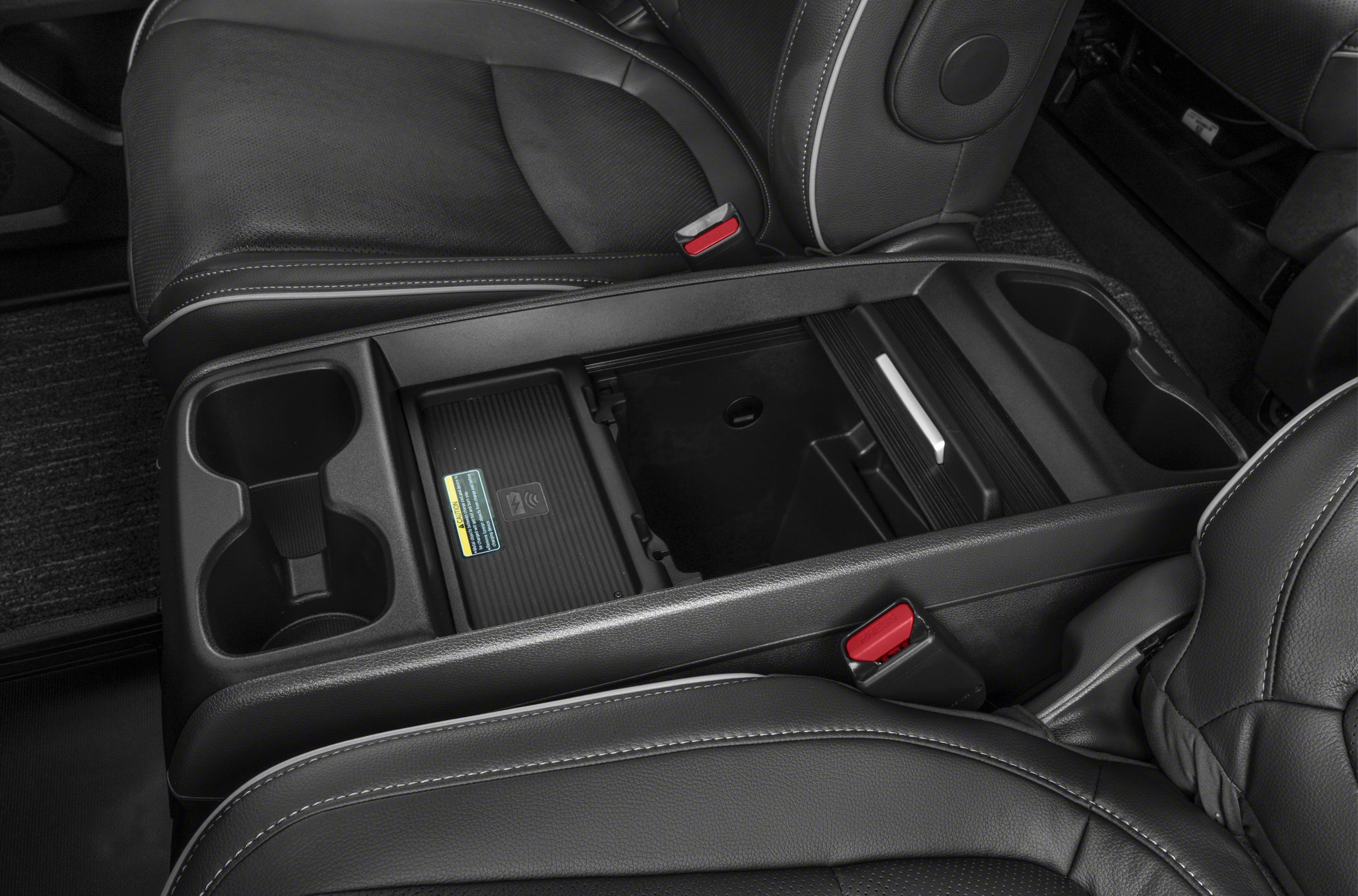 Center console with cup holders and storage compartment