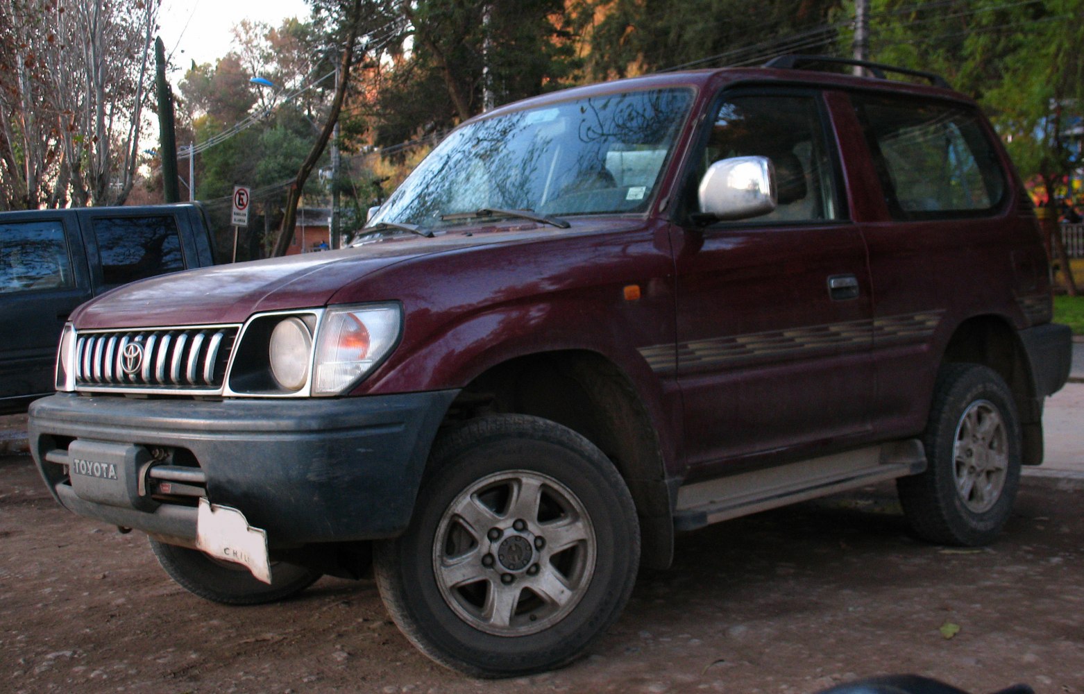 3-door SUV with rugged off-road tires and vintage 1990s design
