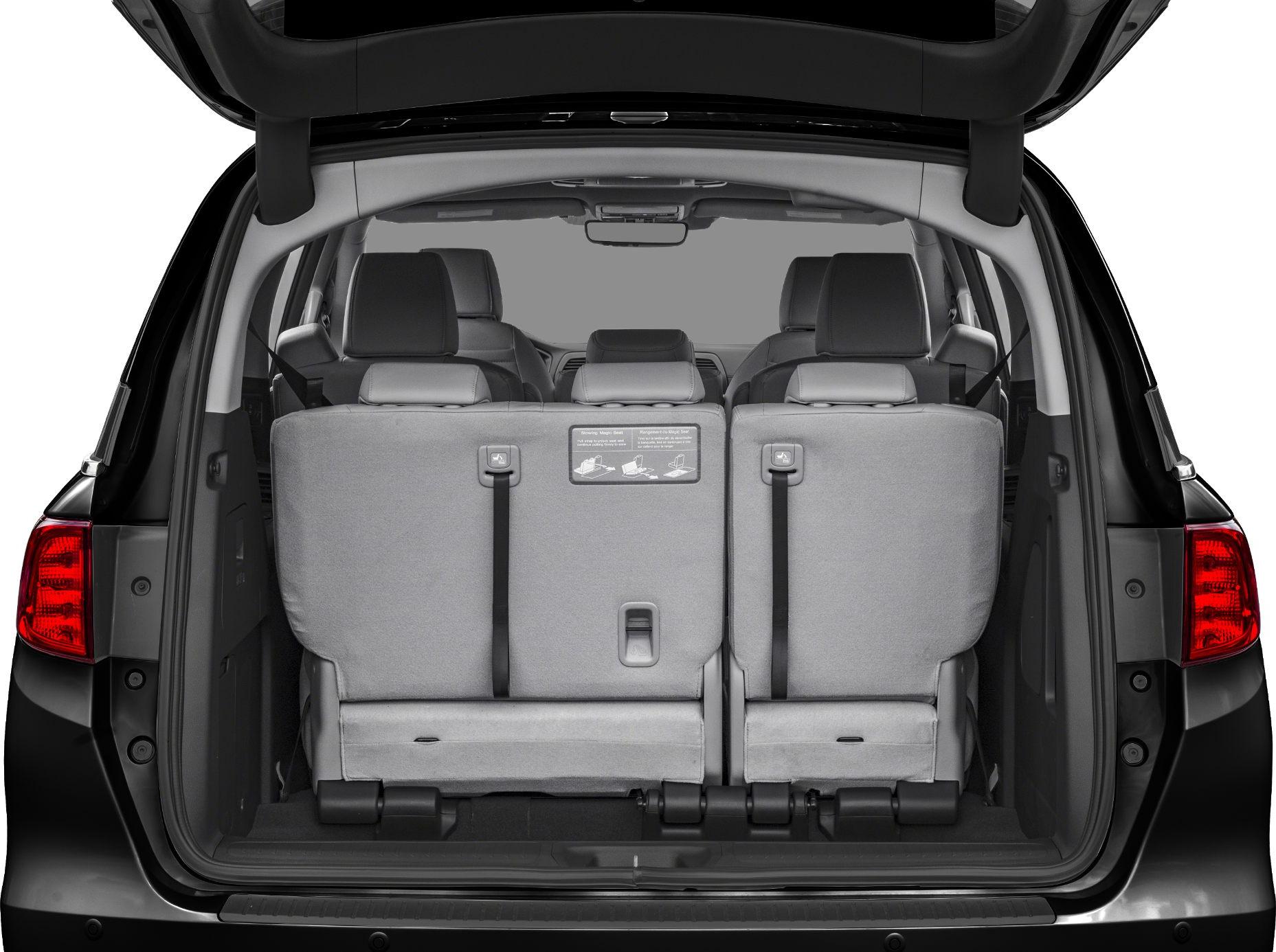 Rear cargo space with folded third-row seats in minivan