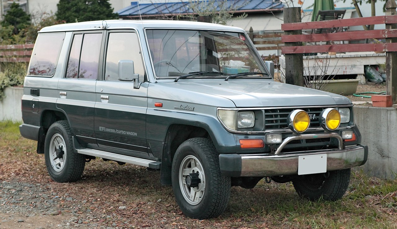 1990s diesel turbo off-road SUV with rugged boxy design and dual yellow auxiliary lights