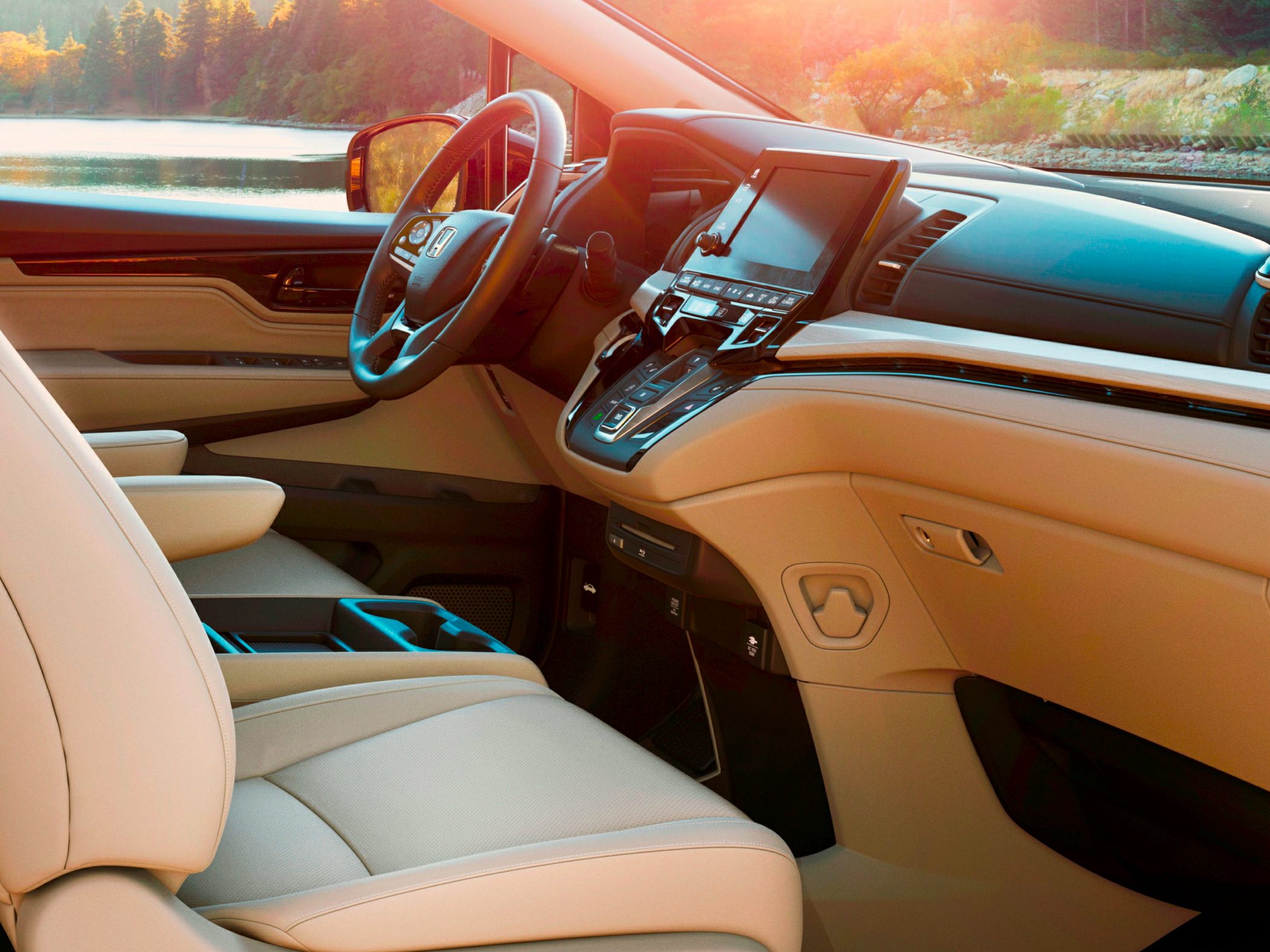 Modern dashboard with touchscreen and beige front seats