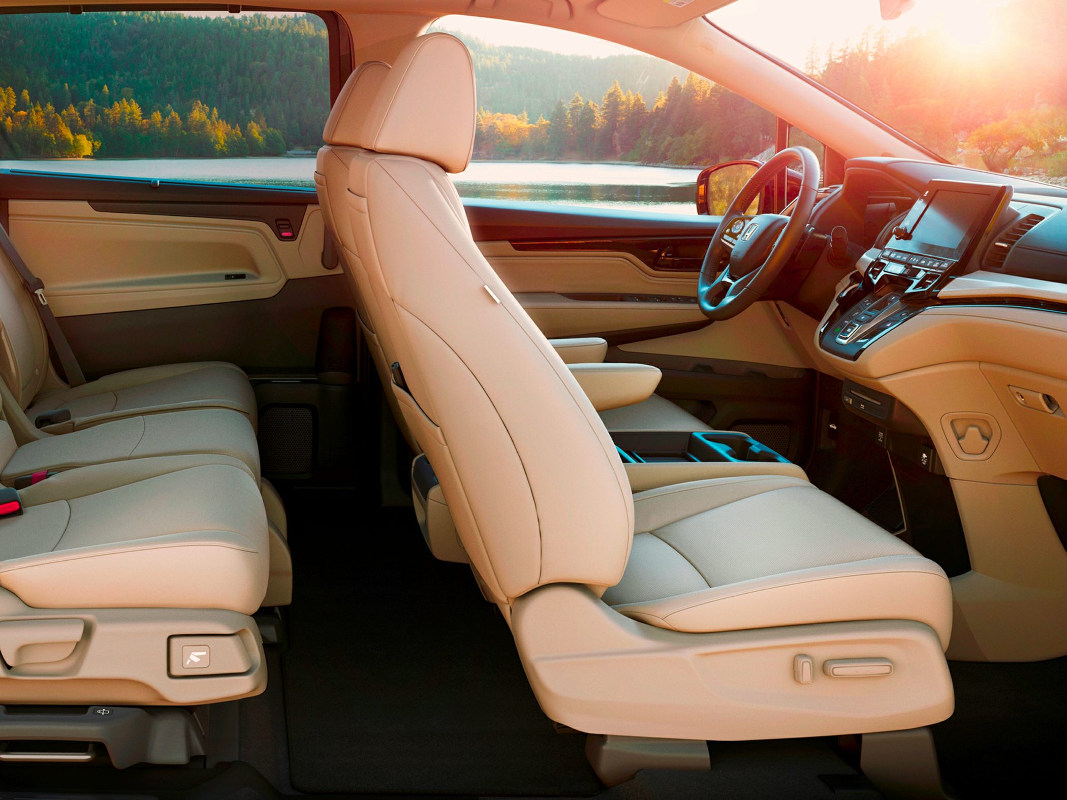 Beige leather seats and modern dashboard with touchscreen display.