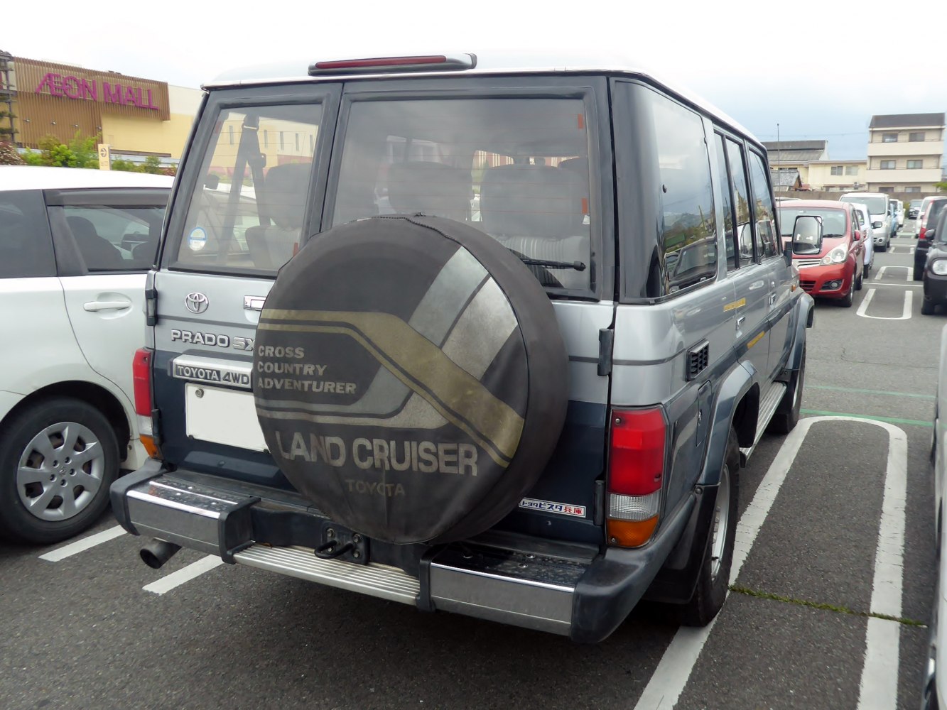 Rear view of SUV with spare tire cover and large windows