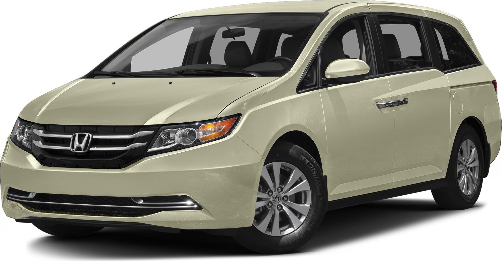 Front-side view of a modern minivan with updated grille and headlights