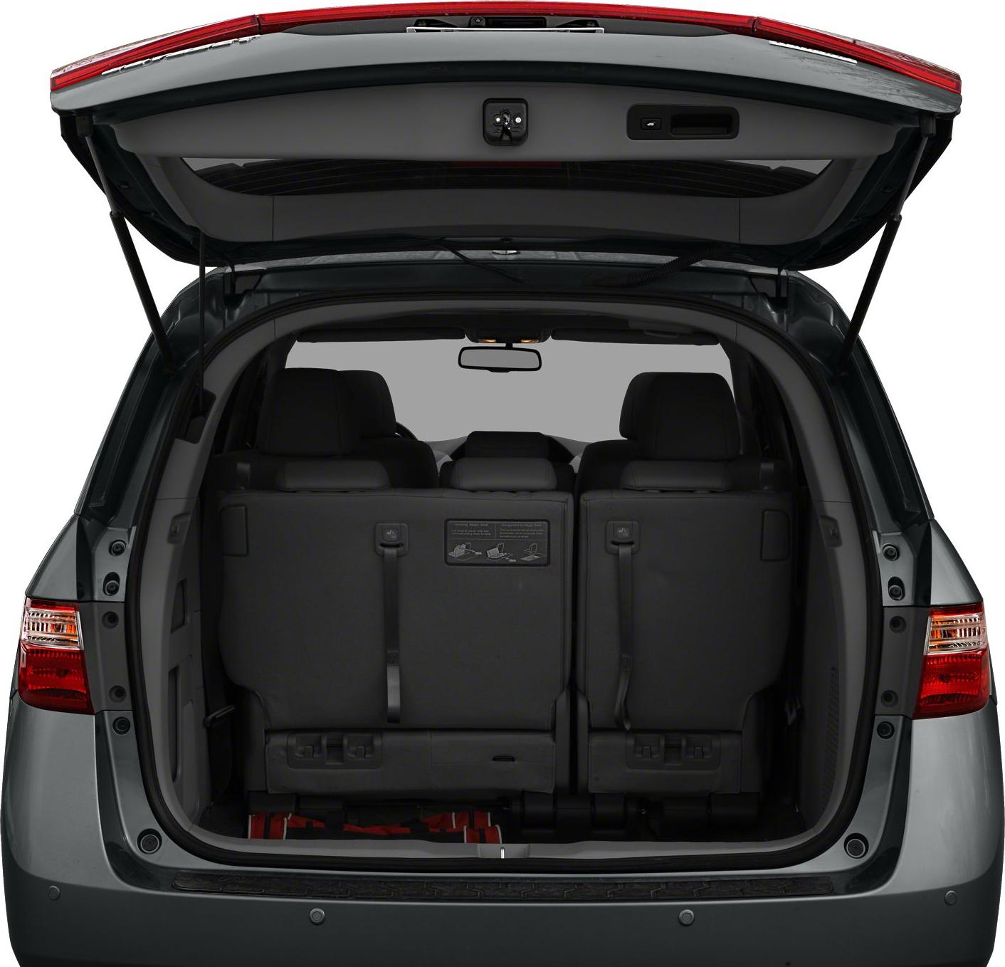Minivan rear hatch open showing three-row seats upright and cargo space