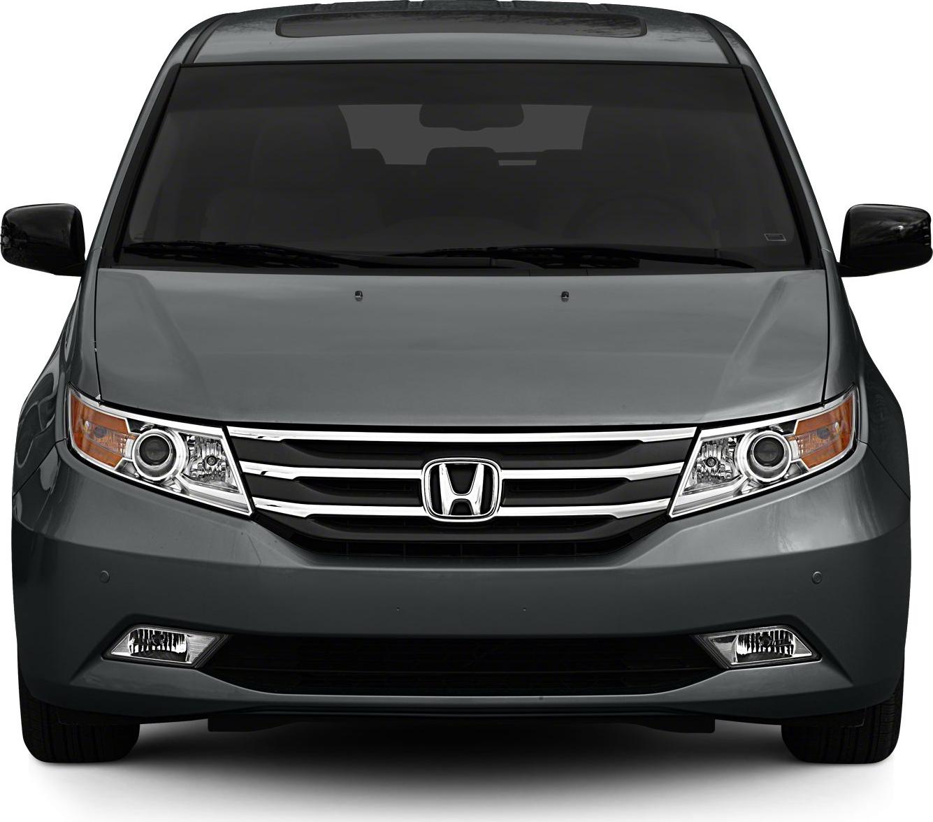 Minivan front with projector headlights and chrome grille