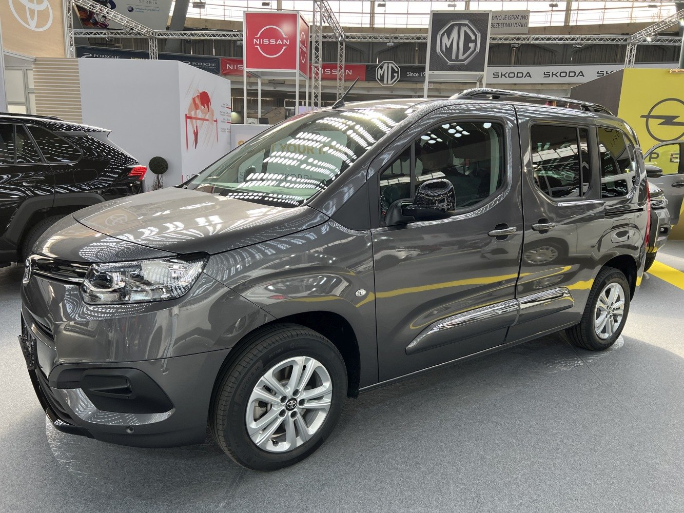 Front side exterior with headlights and alloy wheels