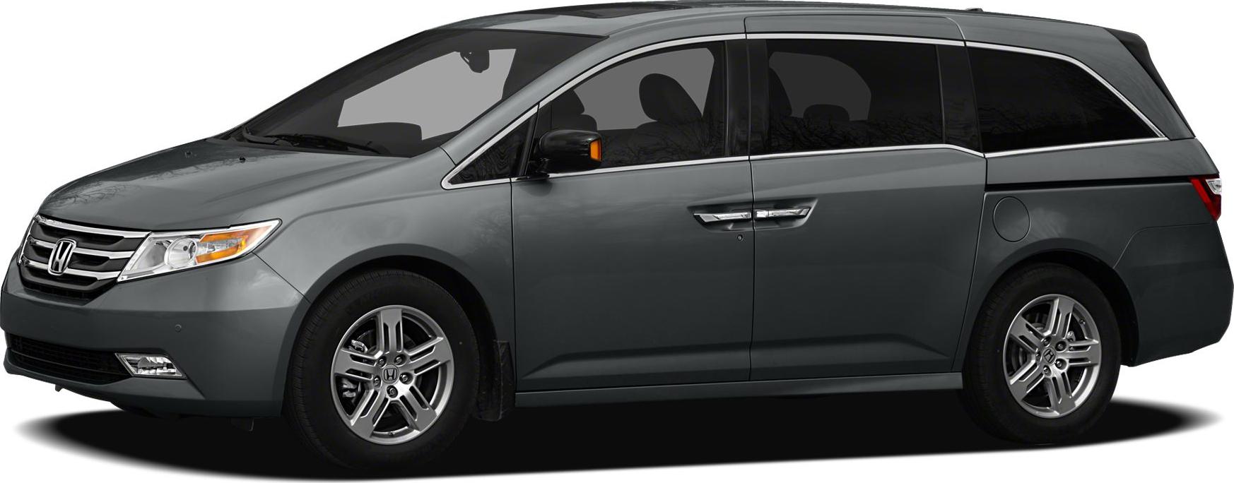 Side profile of minivan with sliding doors and alloy wheels
