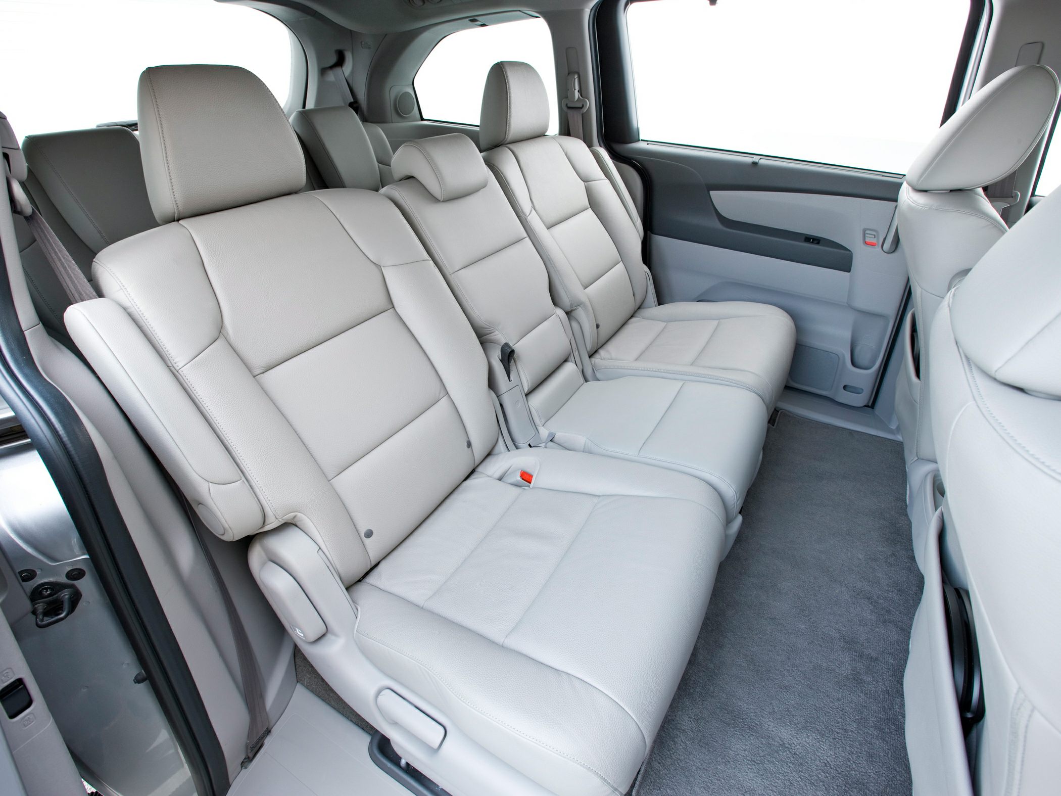 Spacious rear leather seats inside a minivan