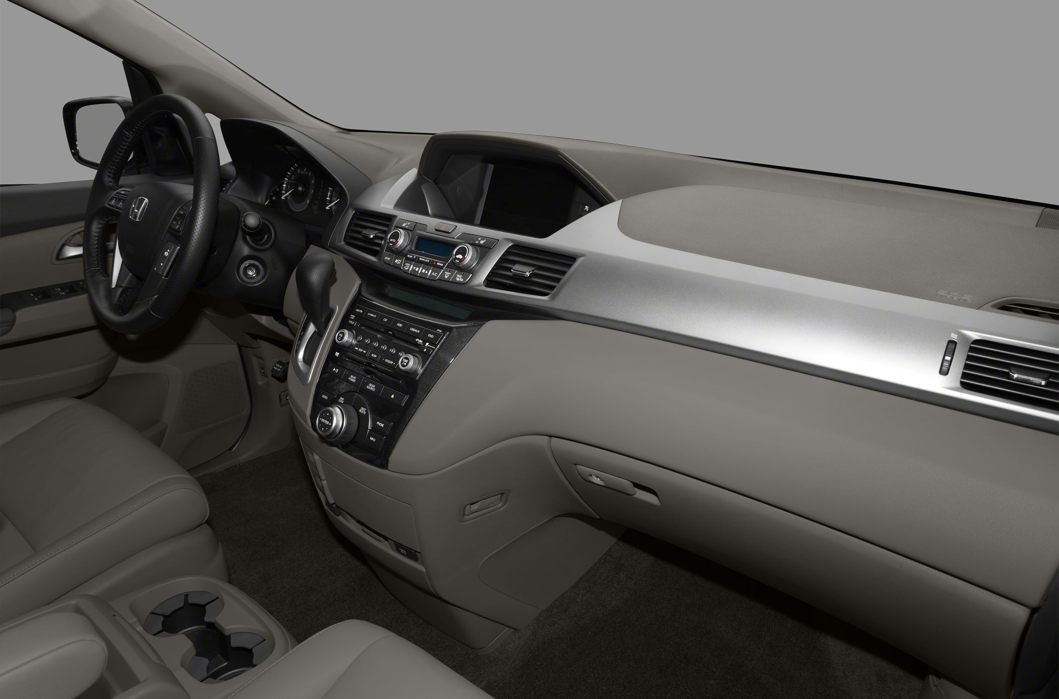 Dashboard, steering wheel, center console with controls and cup holders