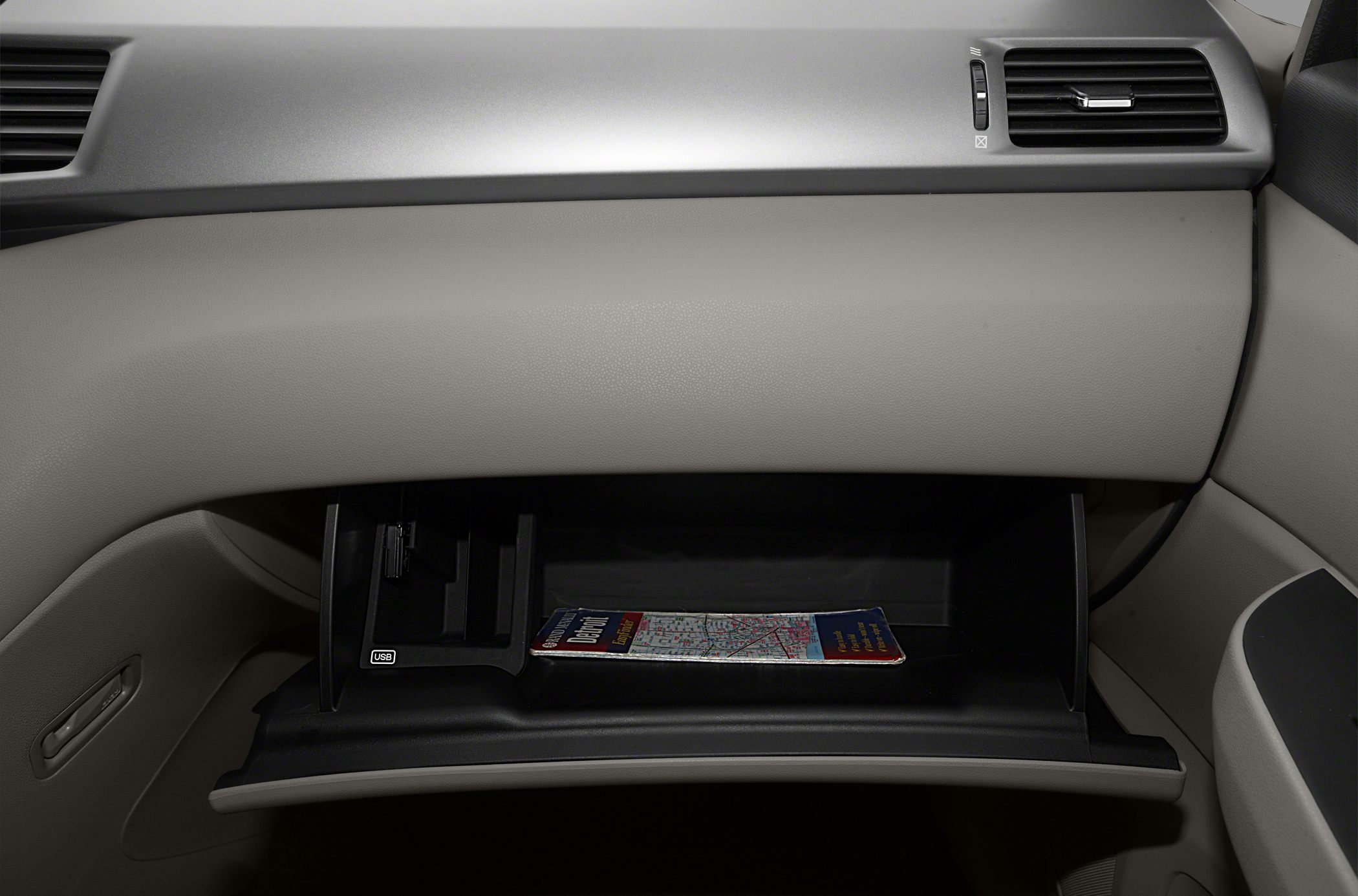 Open glovebox with USB port inside car interior