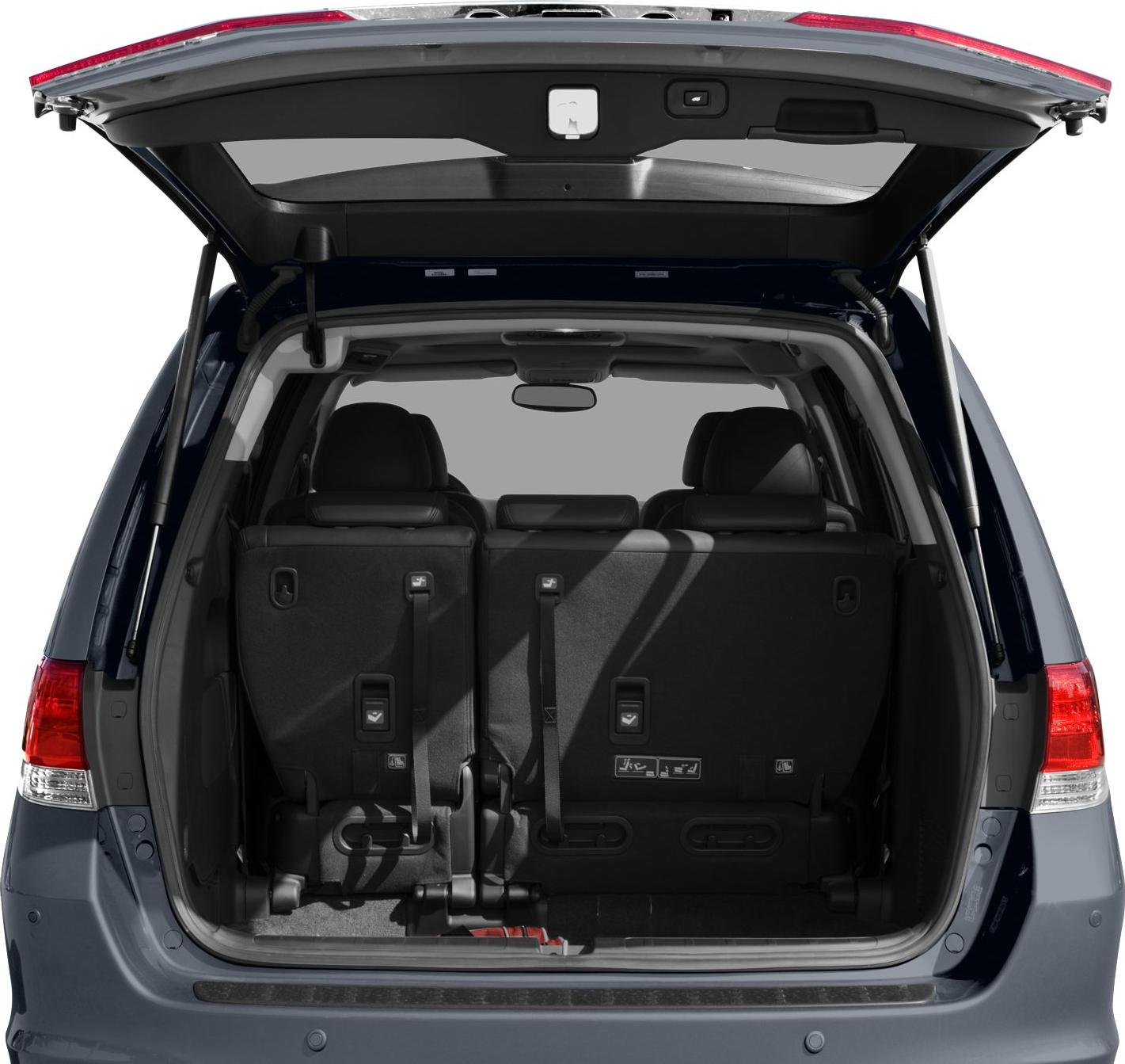Rear view of vehicle with open hatch and visible upright rear seats