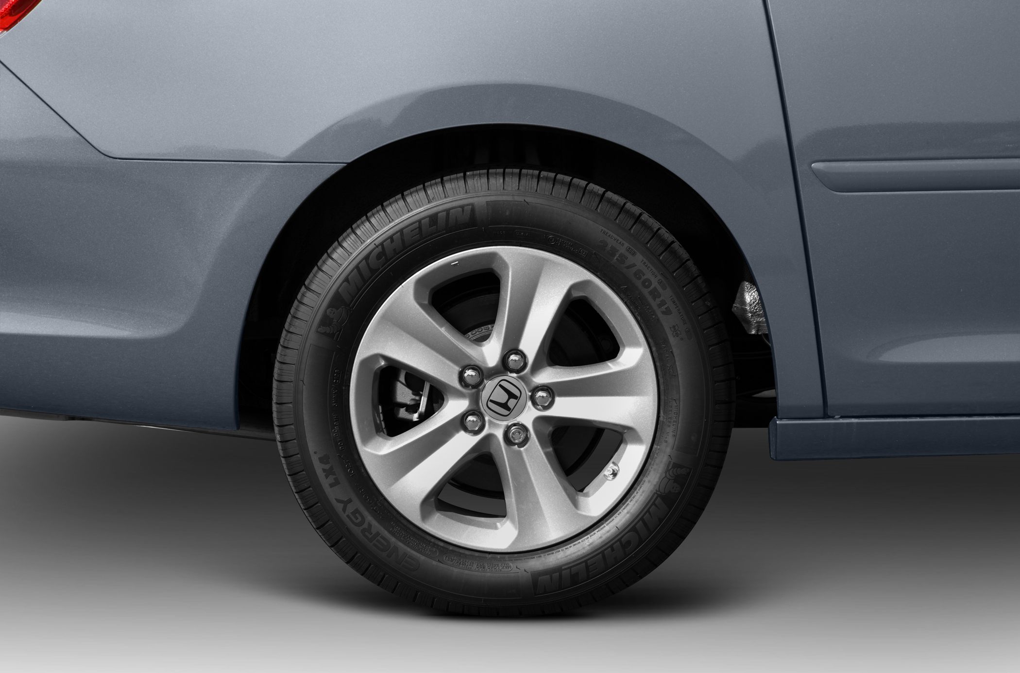 Close-up of alloy wheel and tire on a minivan