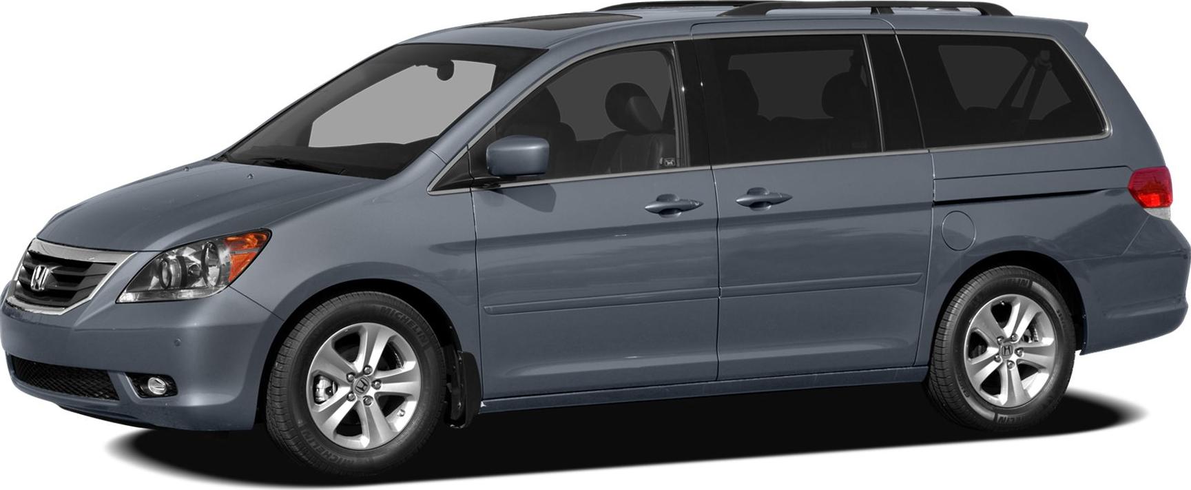 Minivan side profile with sliding rear doors and alloy wheels