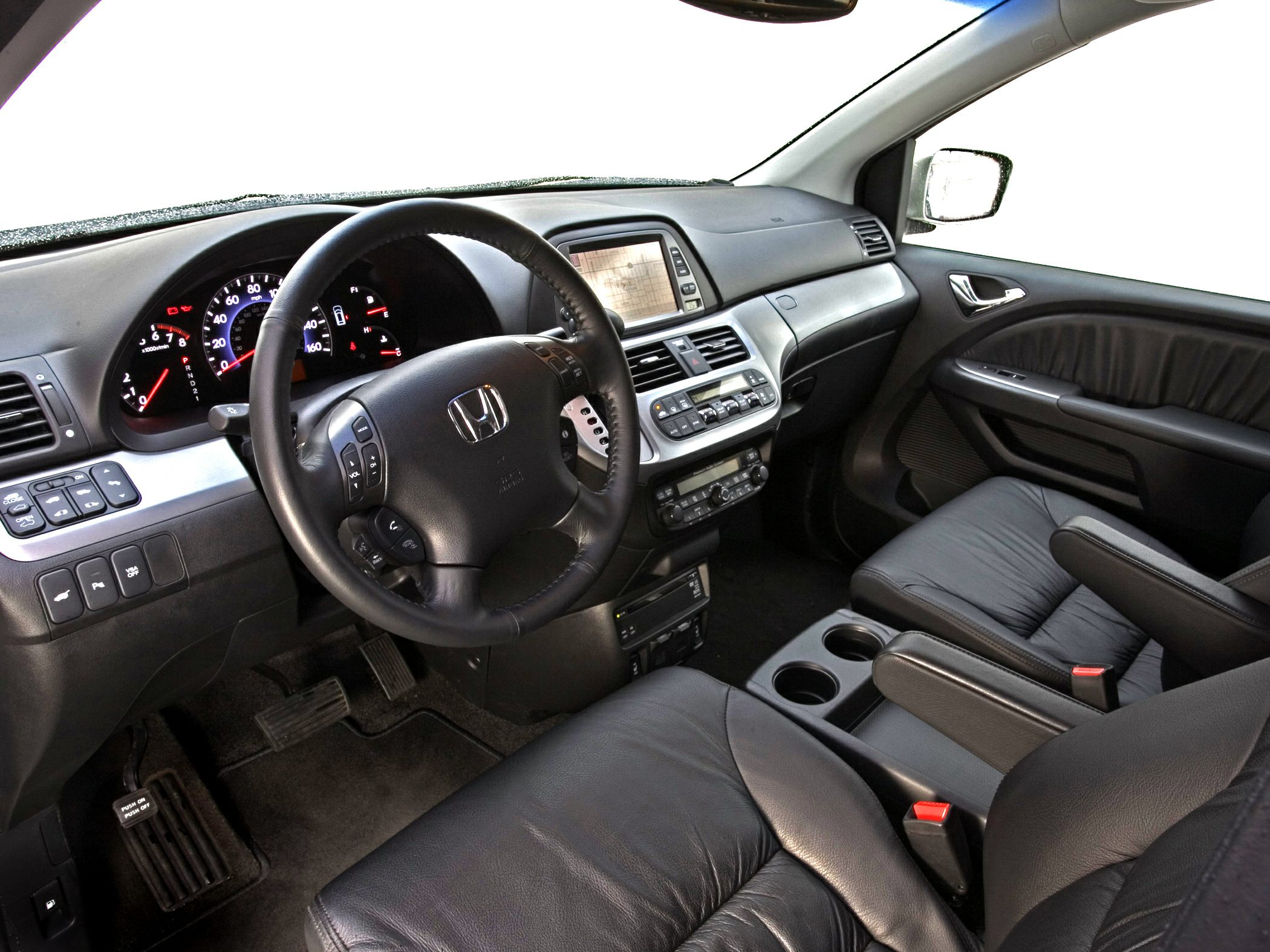 Leather seats and advanced dashboard with navigation and steering wheel controls.