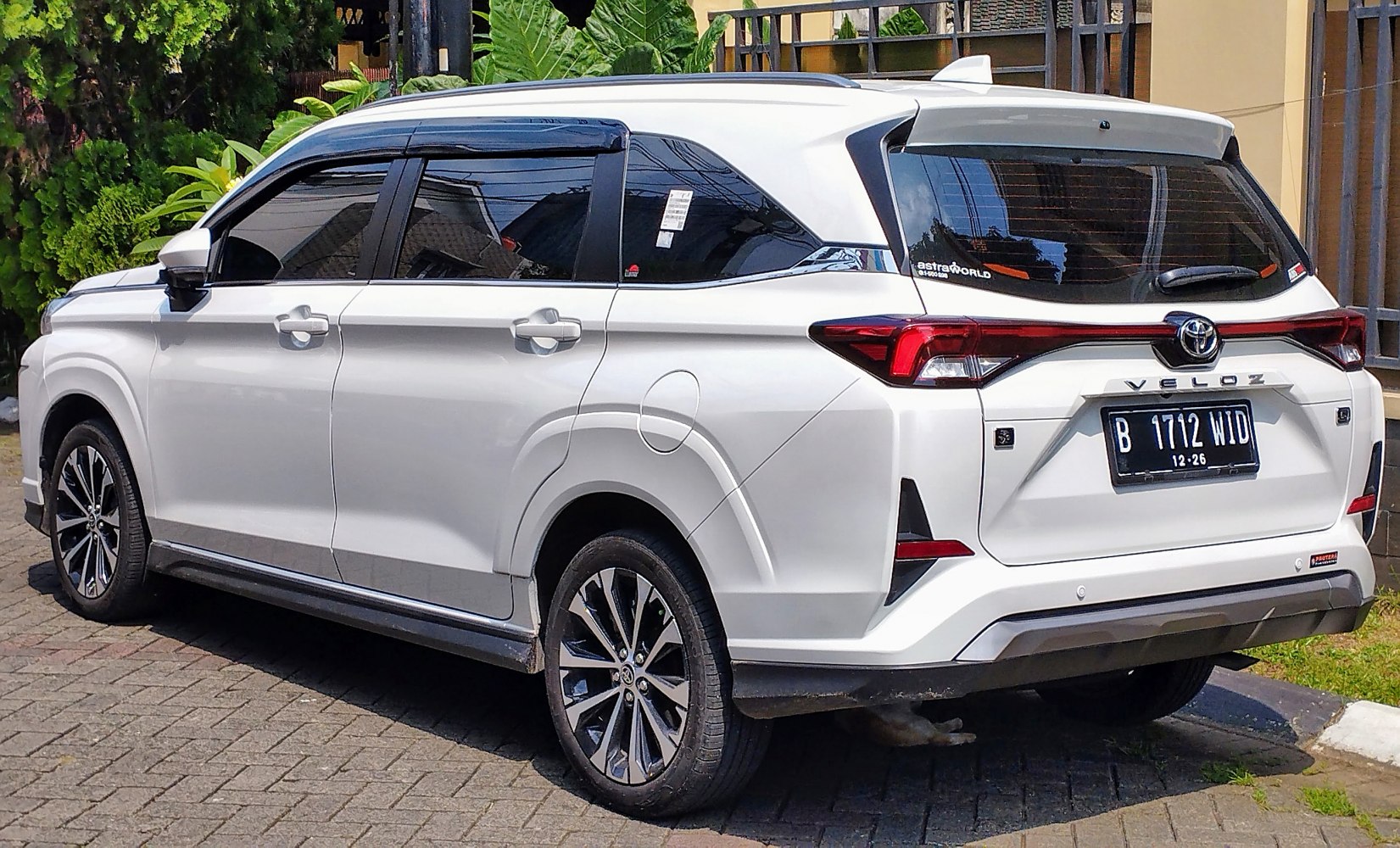 Rear and side view with distinctive taillights and alloy wheels